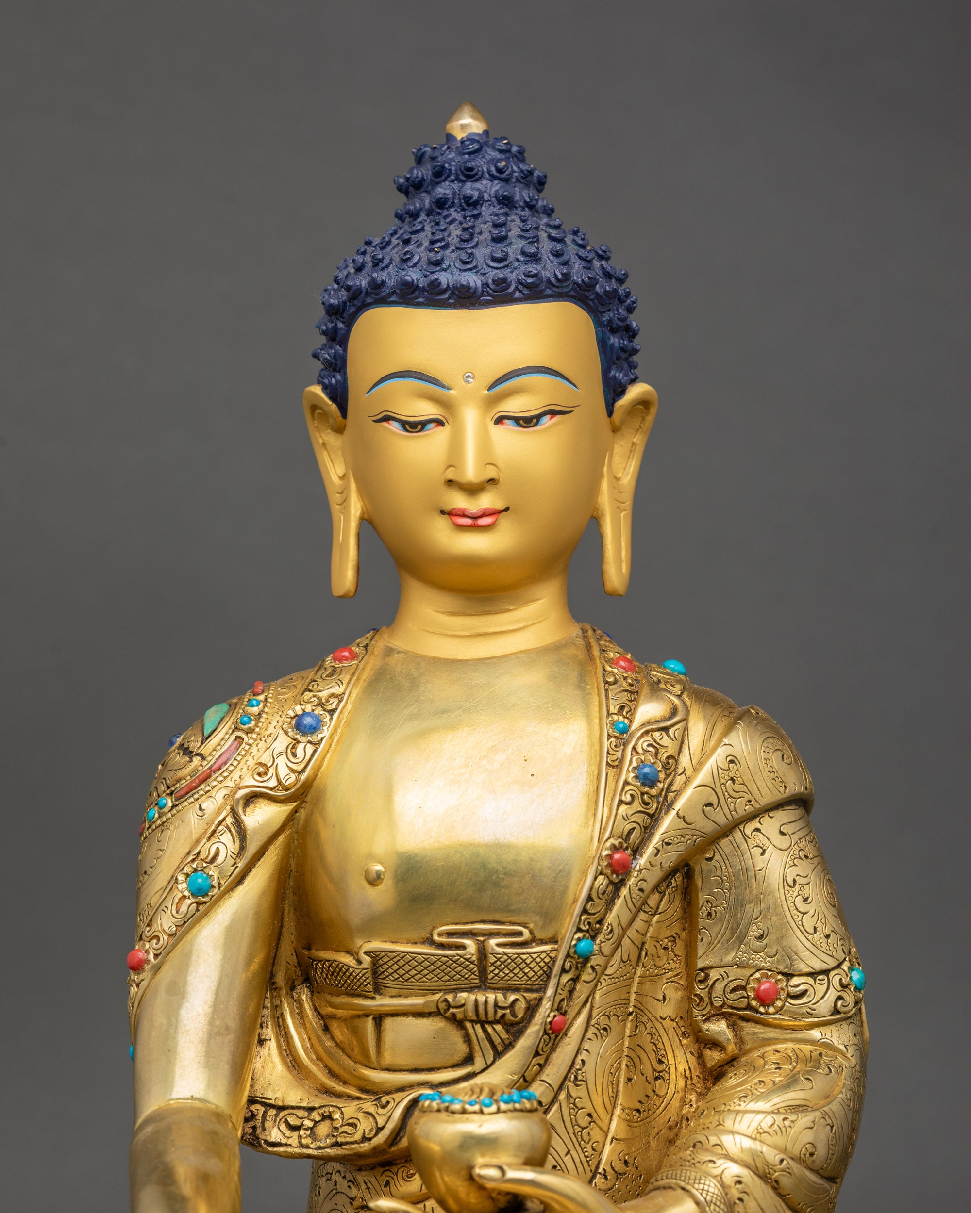 Shakyamuni Buddha close up gold-gilded face meditation Himalayan artwork