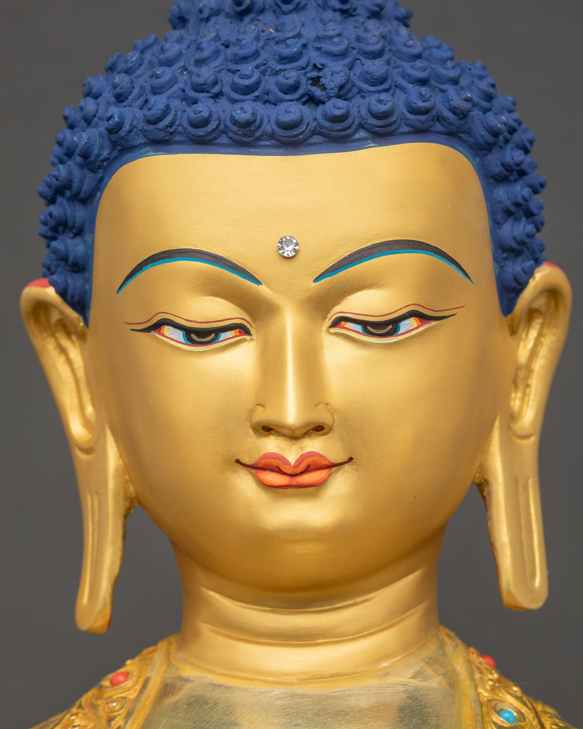 Shakyamuni Buddha face close up serene expression 24K gold gilding