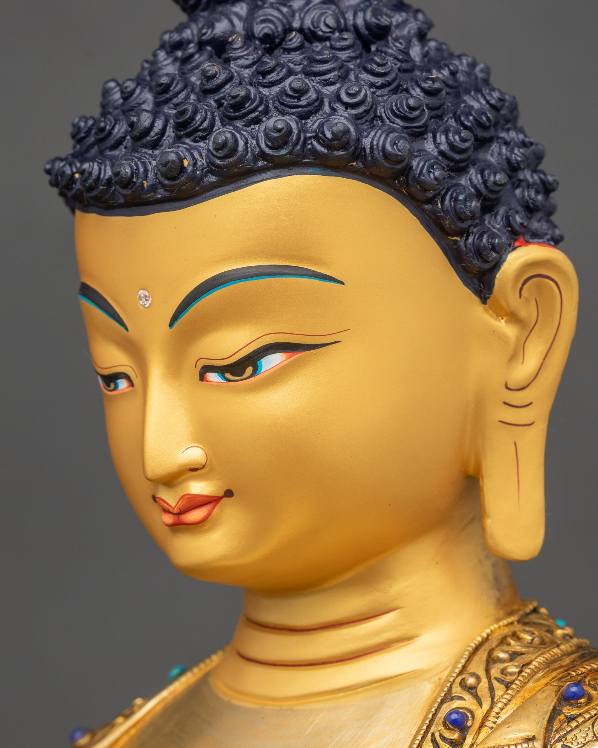 Shakyamuni Buddha face side close up gold-gilded copper sacred sculpture