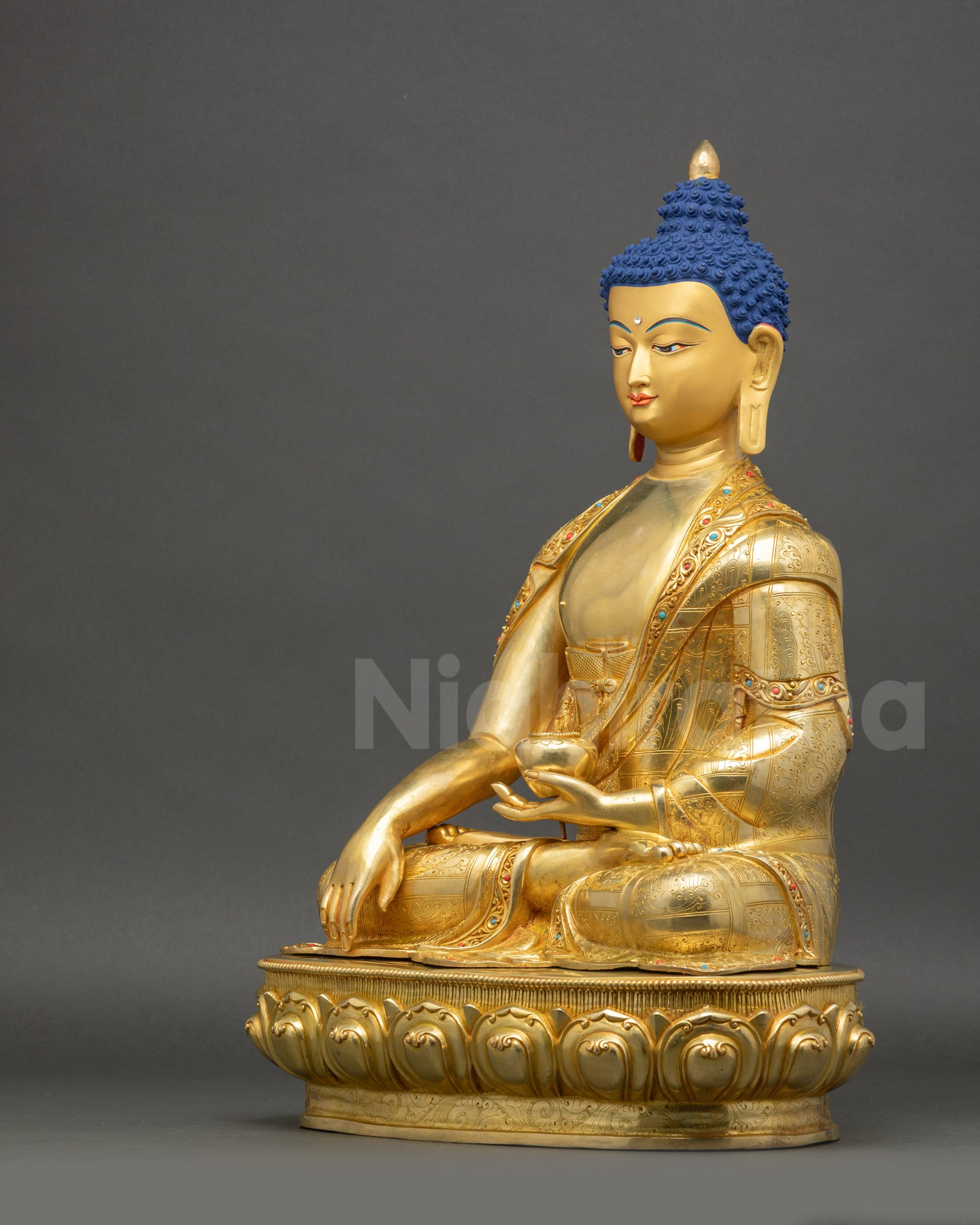 Shakyamuni Buddha left side view intricate gold-gilded monastic robes
