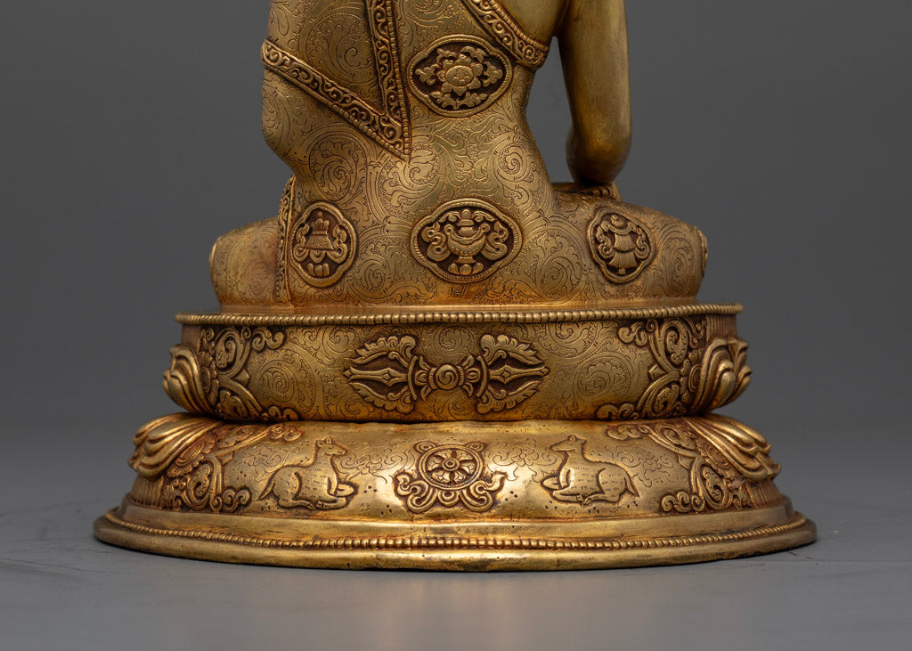 View of Shakyamuni Buddha's lower back highlighting the patterns and details on the lotus base.