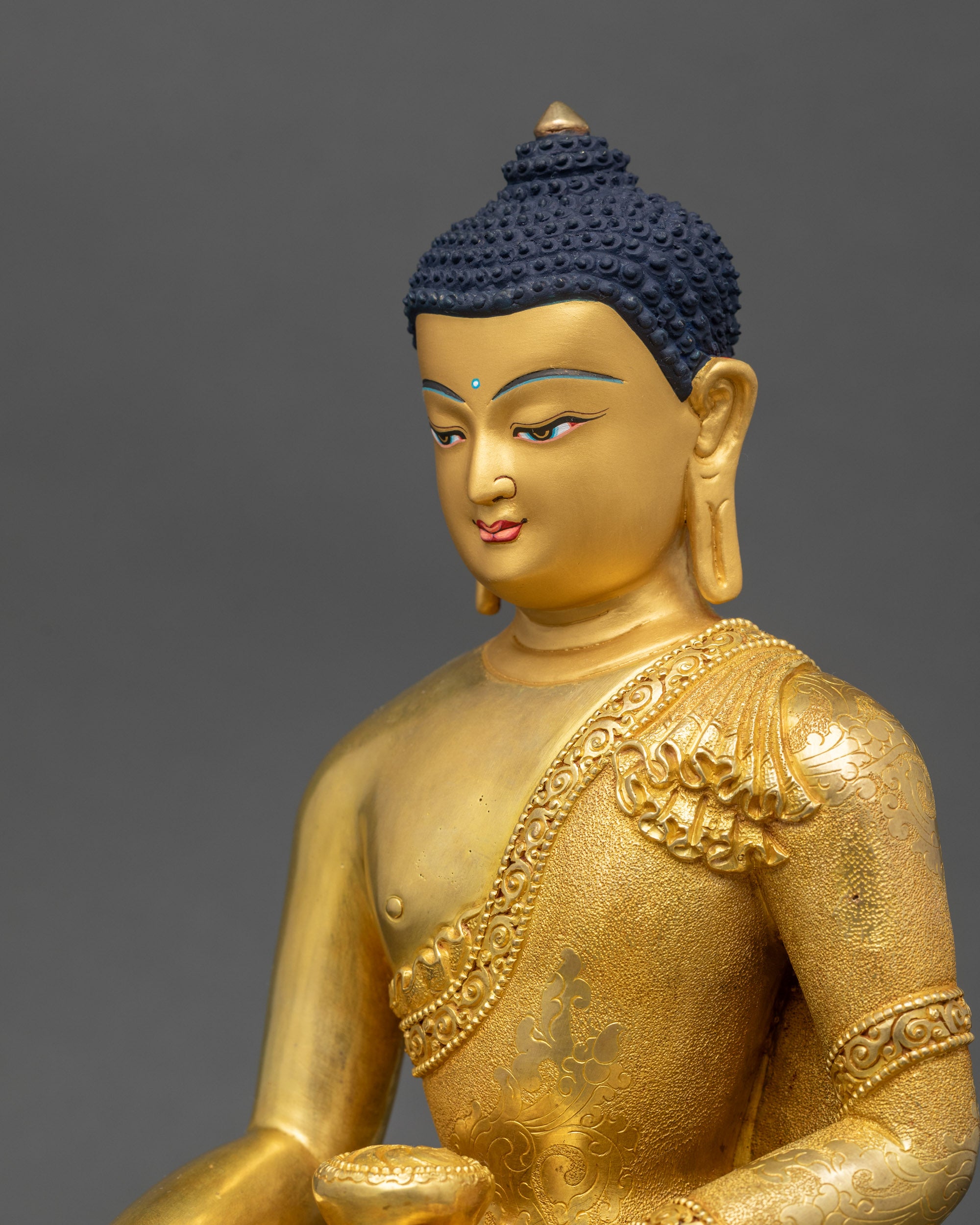 Shakyamuni Buddha statue detailed side close up showing carved robe patterns