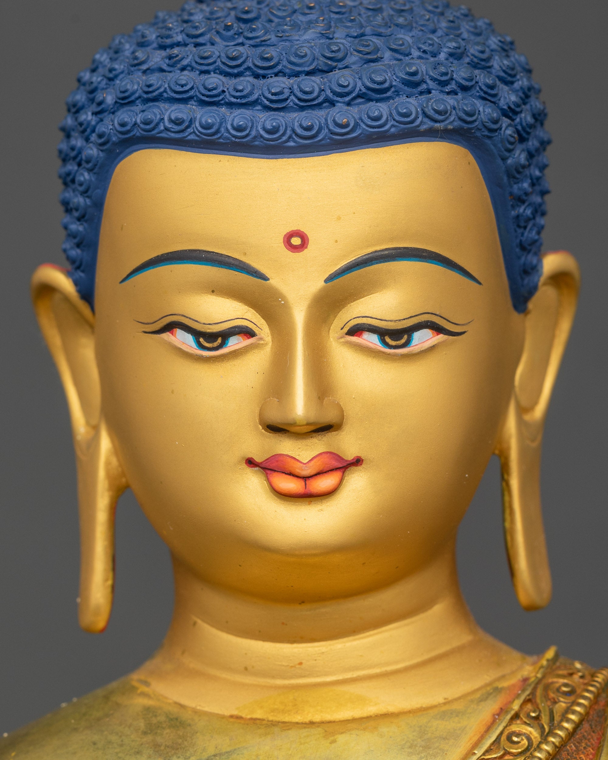 Shakyamuni Buddha statue gold-painted face intricate 3D detailing close up