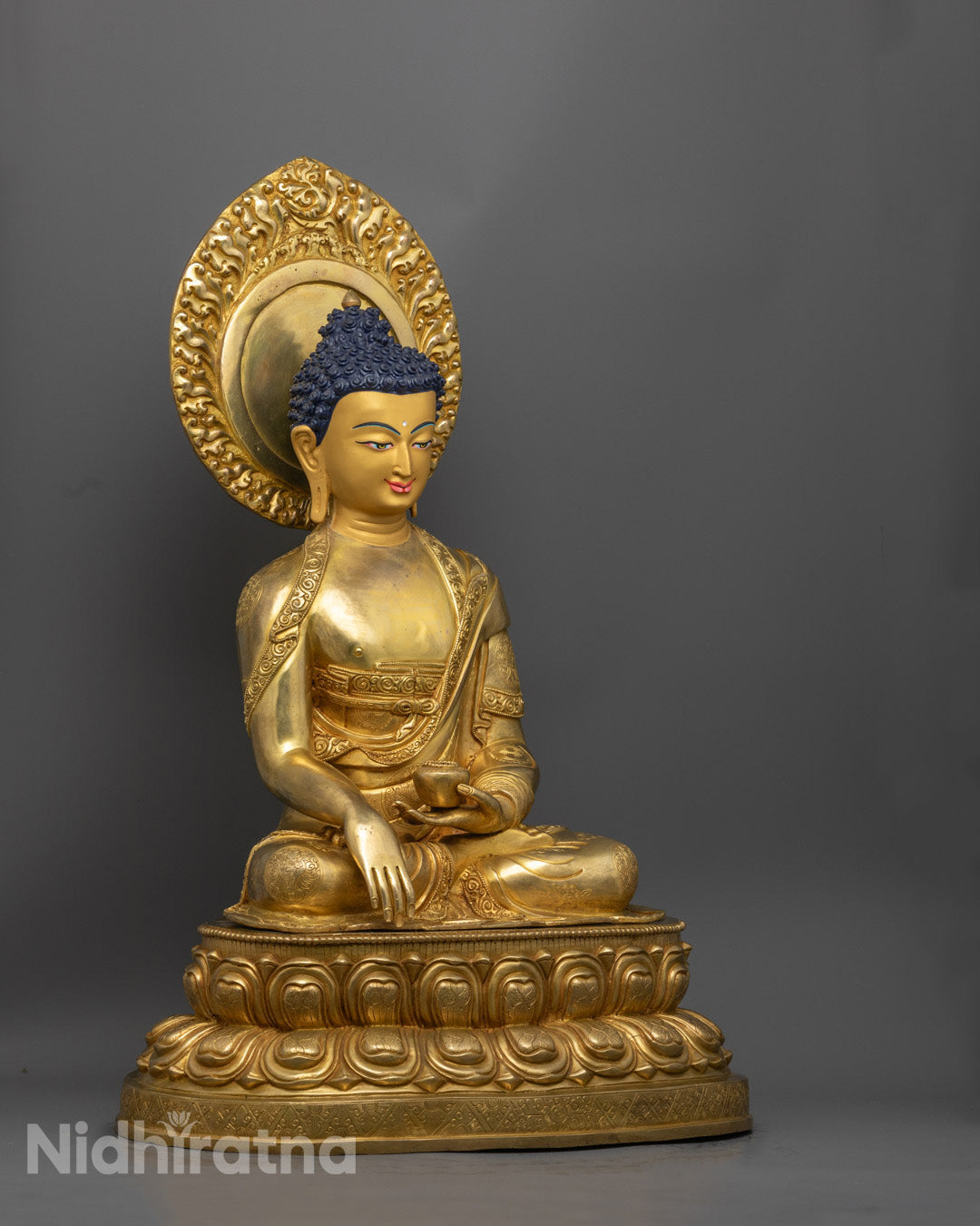 Shakyamuni Buddha statue showcasing intricate craftsmanship, with serene facial expression and peaceful posture, handcrafted in Nepal