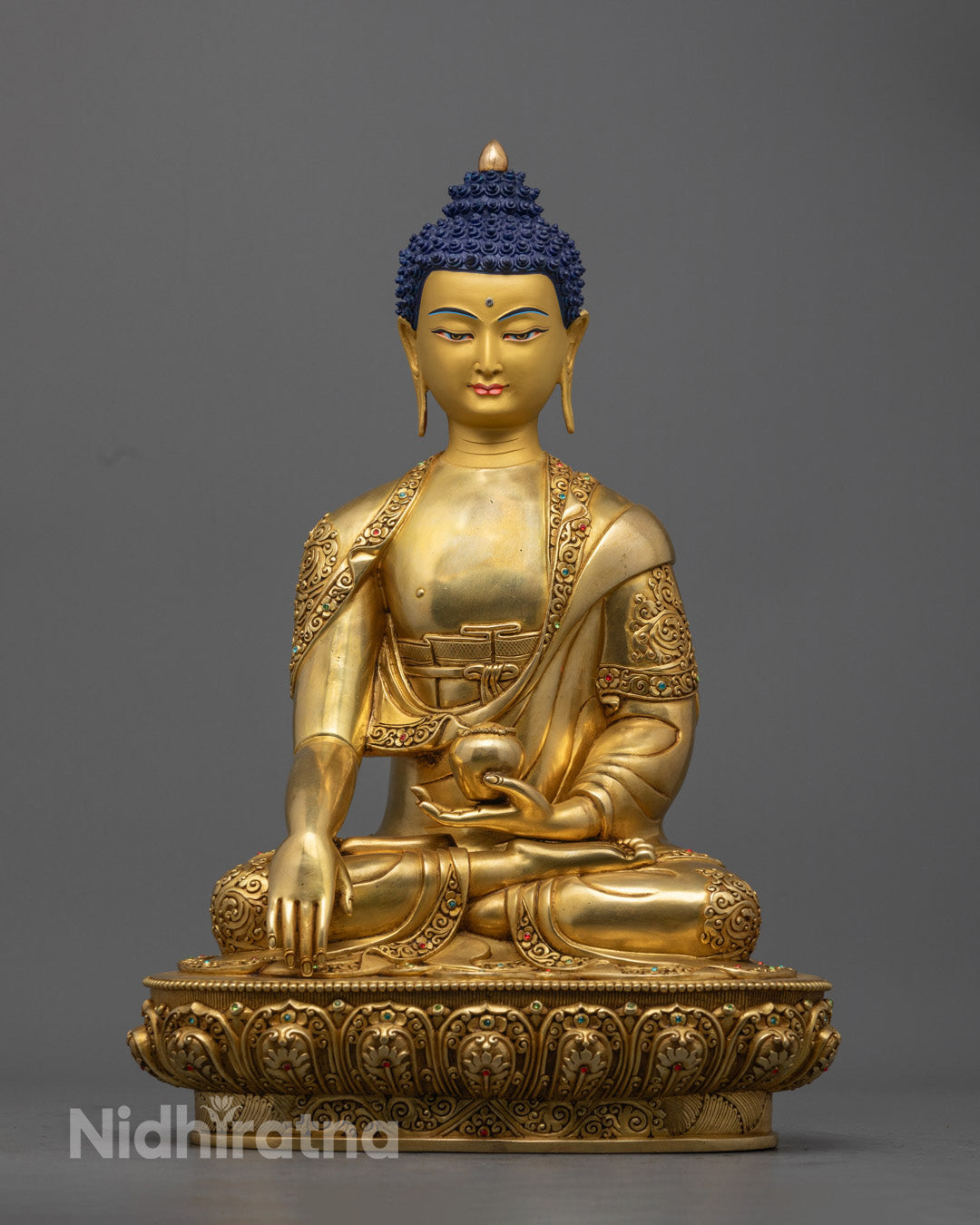 Shakyamuni Buddha statue with intricate carvings showcasing detailed craftsmanship.