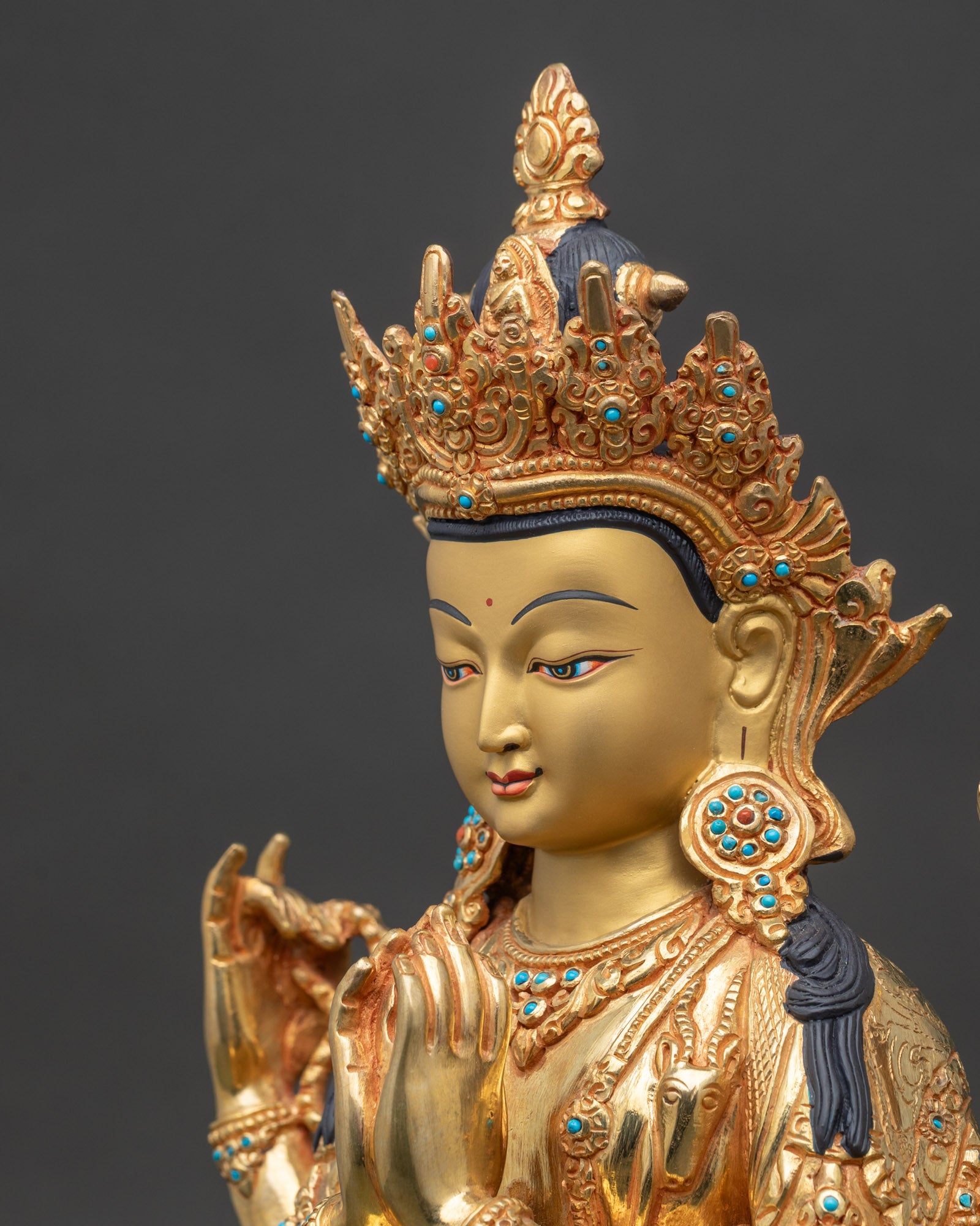 Side detail close up of Chenrezig statue lotus and mala gold fire gilded copper