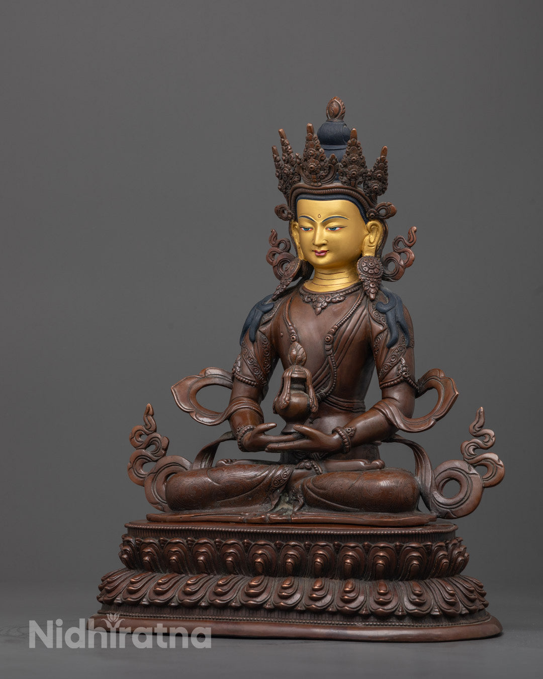 Side-View of Traditional Tibetan Amitayus Buddha statue featuring oxidized copper