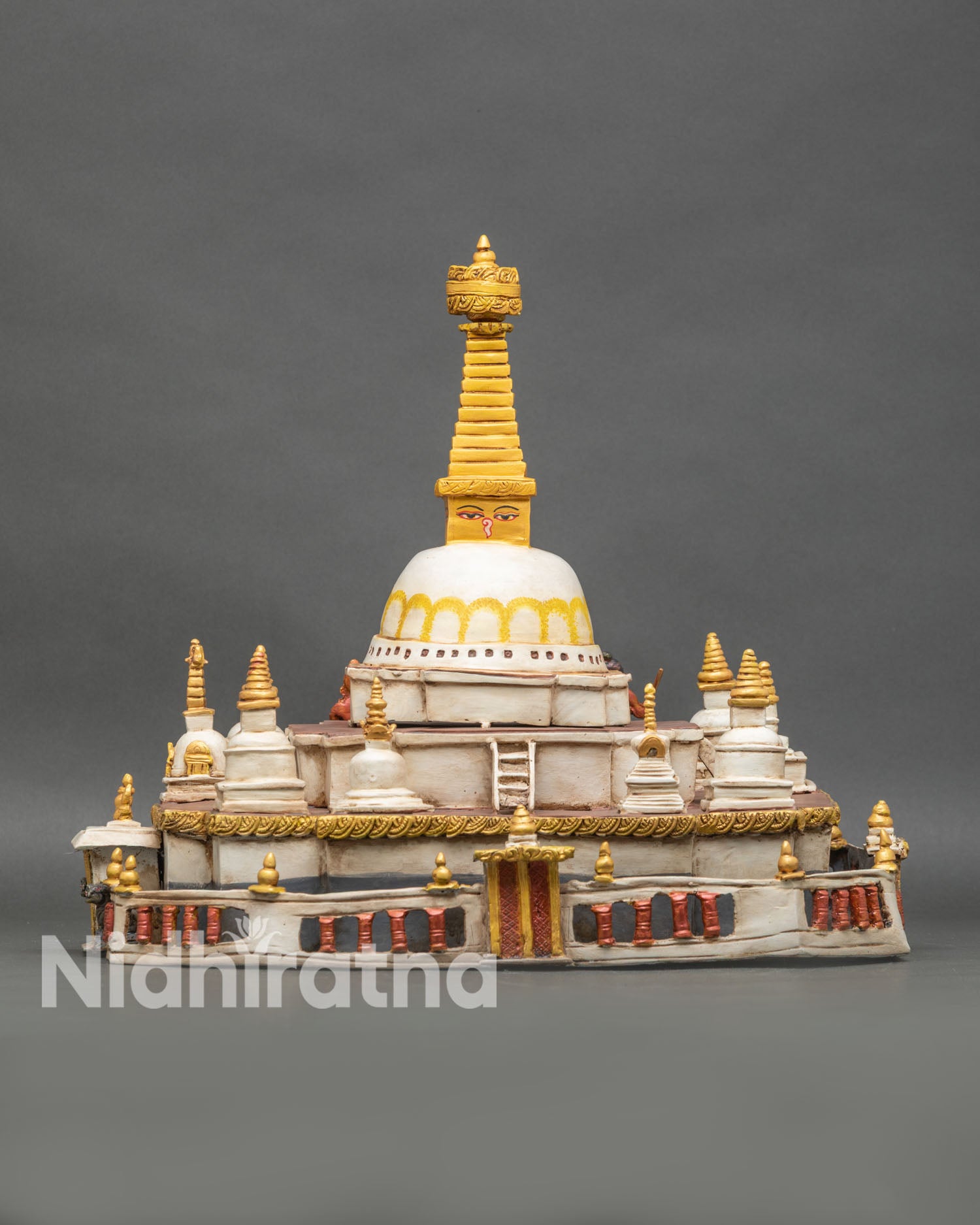 Side perspective of Boudha Stupa statue showing detailed shrine and base carvings