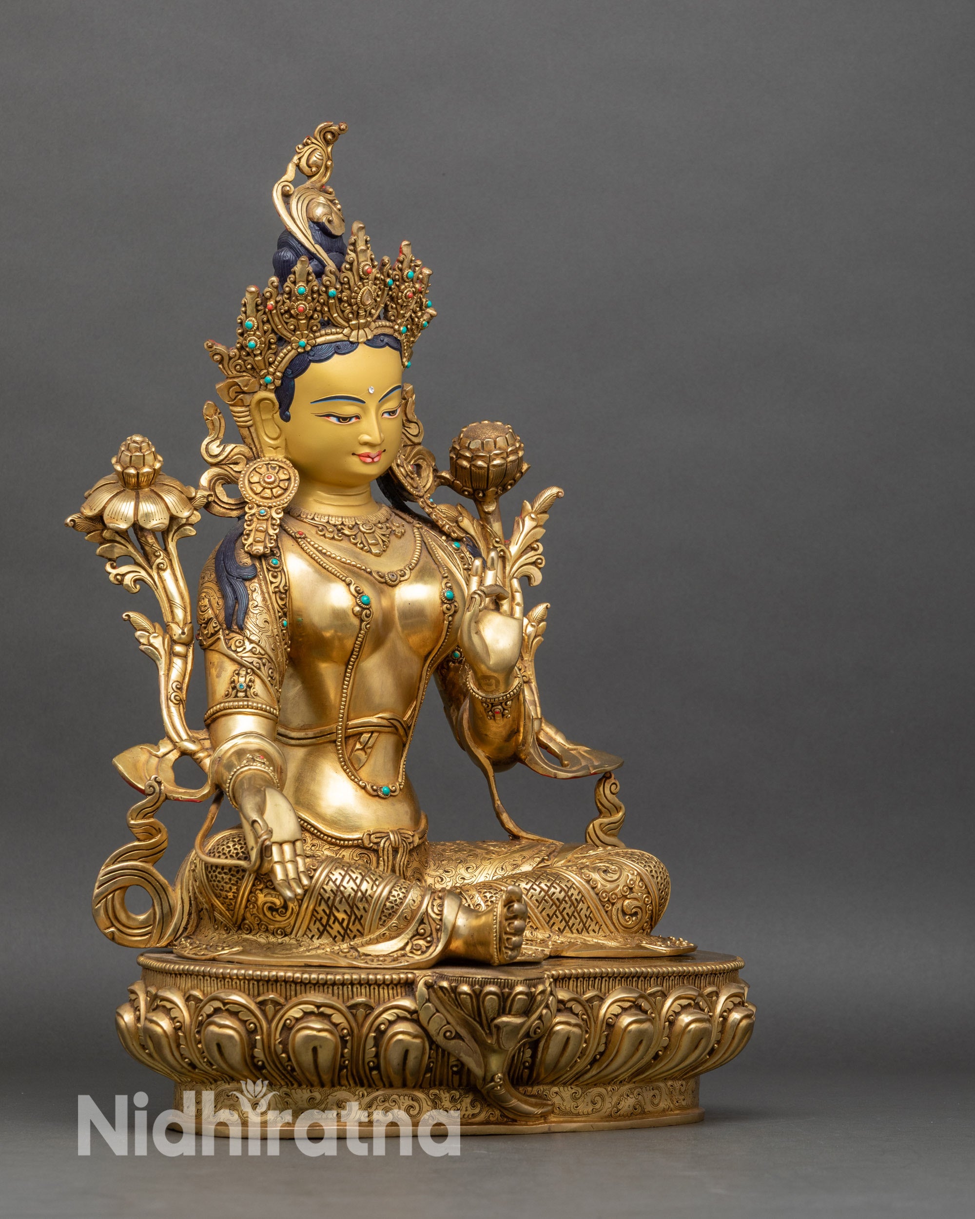 Side-view-Green-Tara-statue-right-leg-extended-left-leg-folded-lotus-pedestal