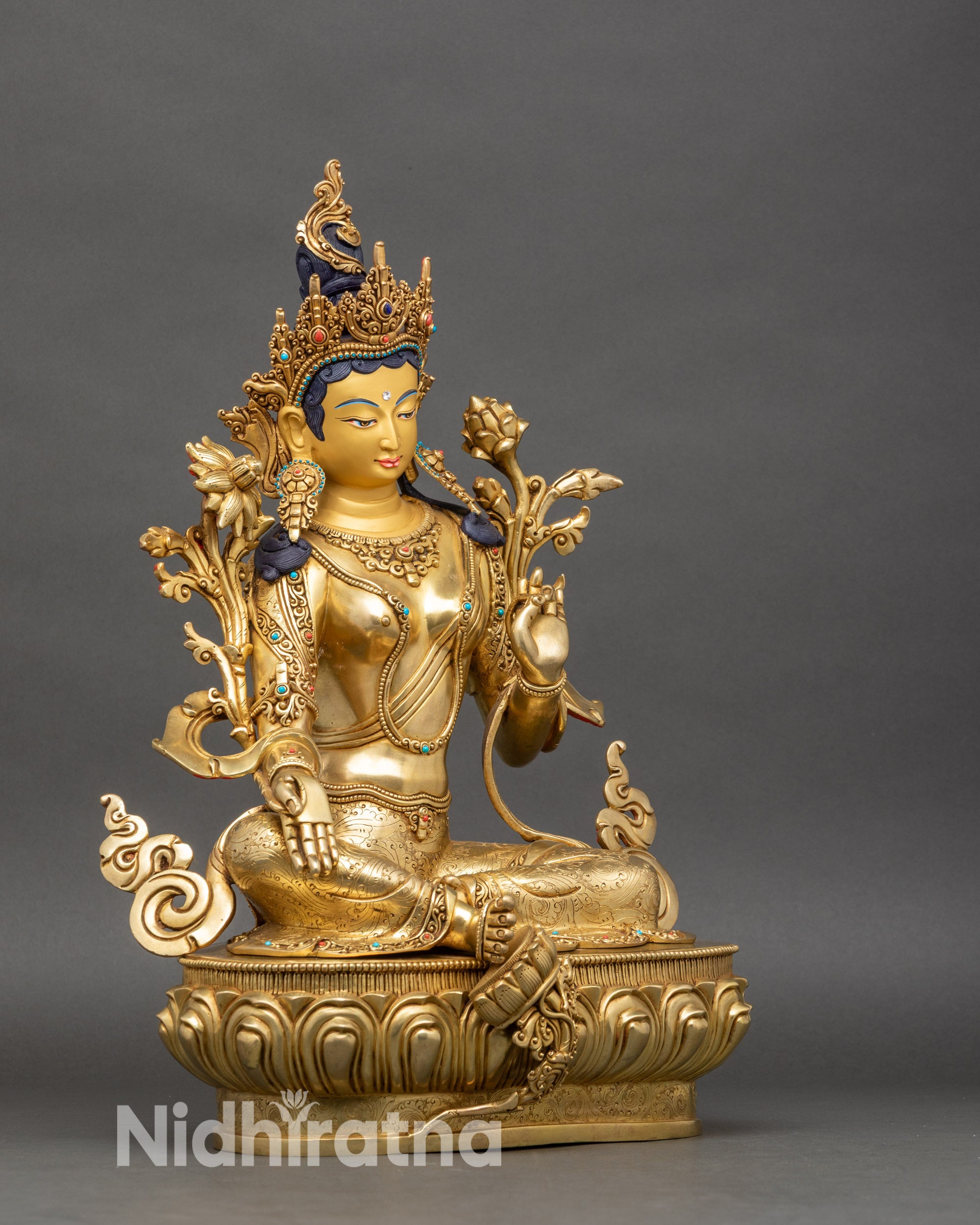 Side-view-Green-Tara-statue-right-leg-extended-left-leg-folded-meditative-pose