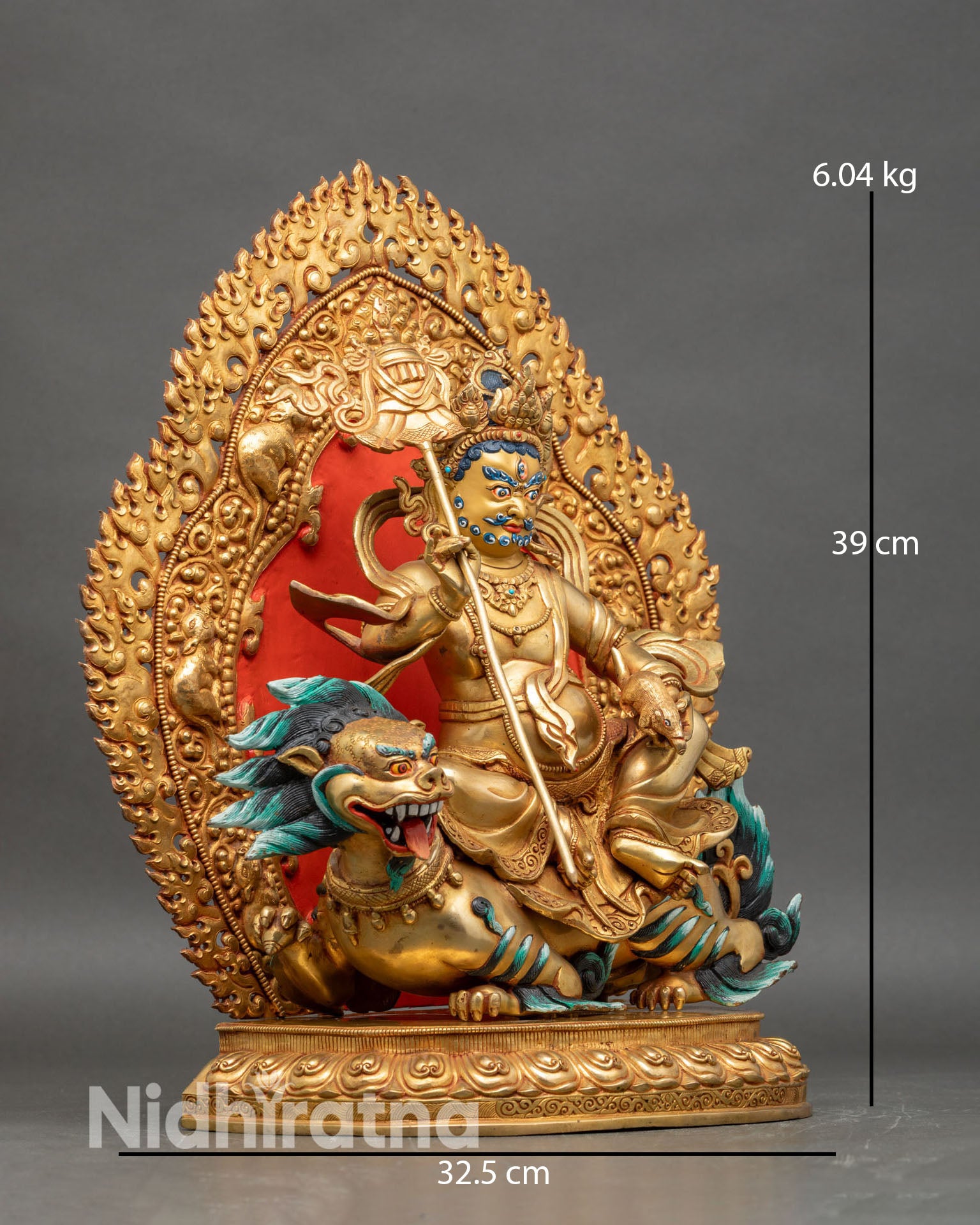 Side view of Namtoshe statue holding Victory Banner and Mongoose Tibetan protector deity