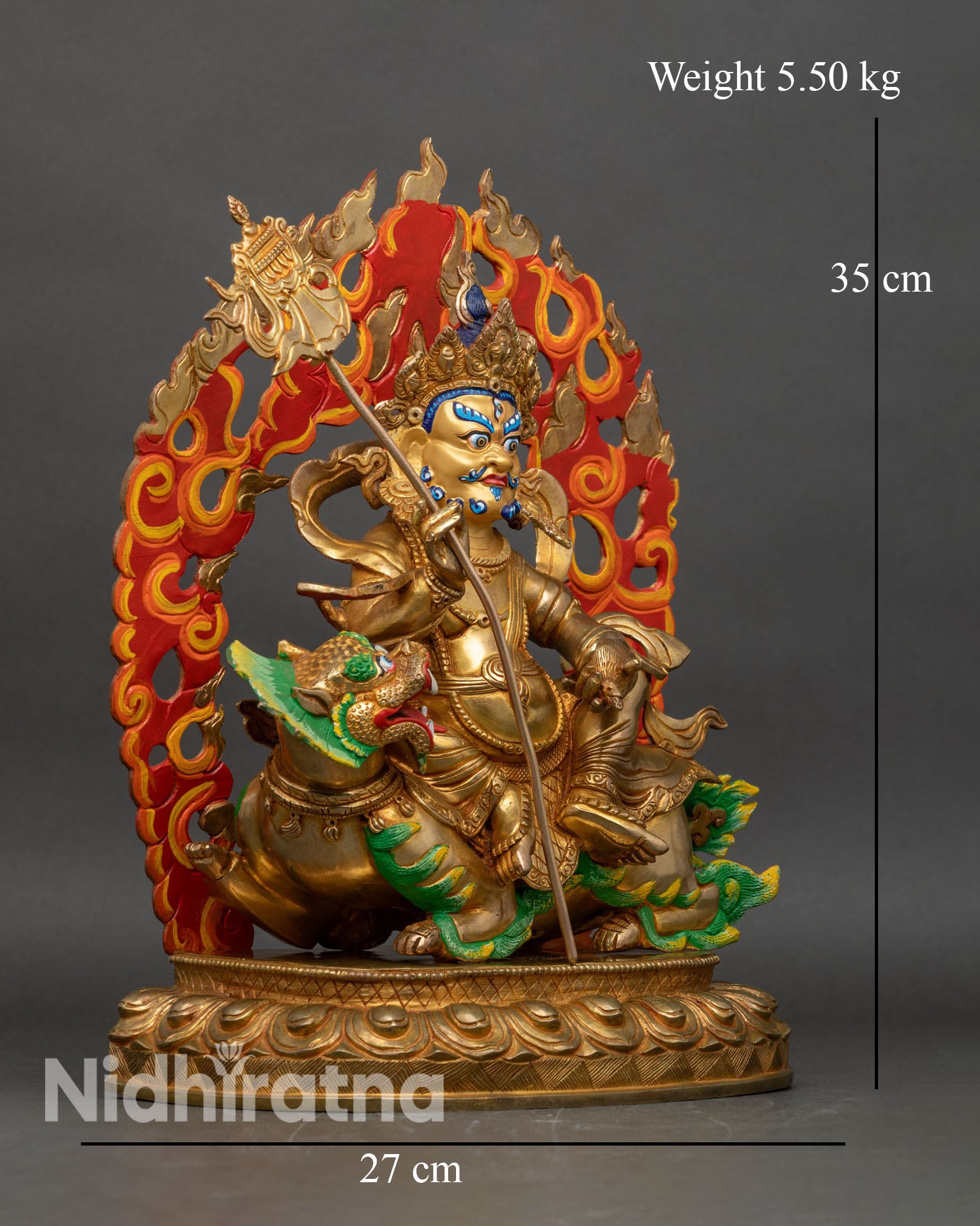 Side view of Namtoshe statue holding victory banner and mongoose copper Buddhist deity