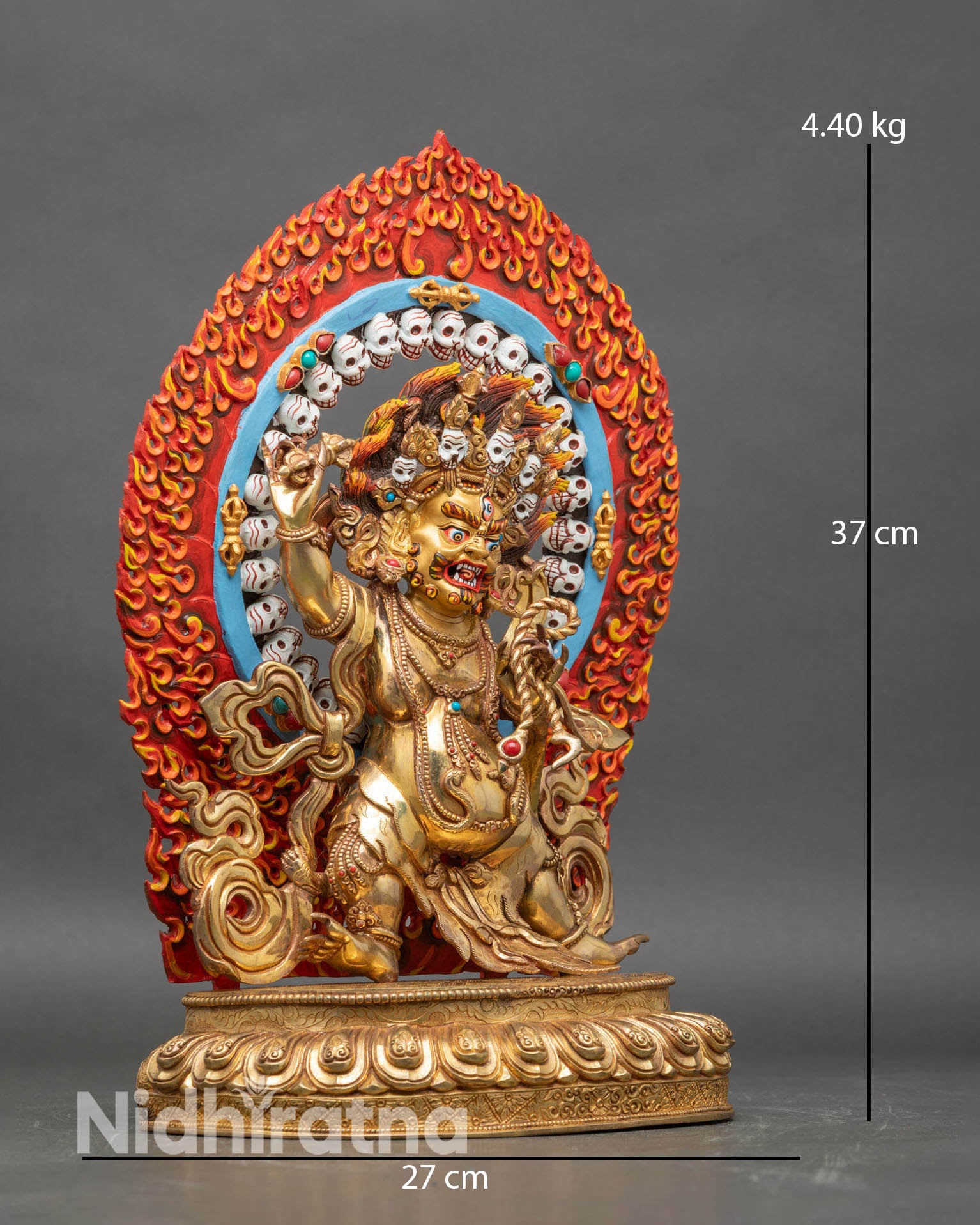 Side view of Vajrapani statue standing on lotus seat flowing robe blazing halo Tibetan art