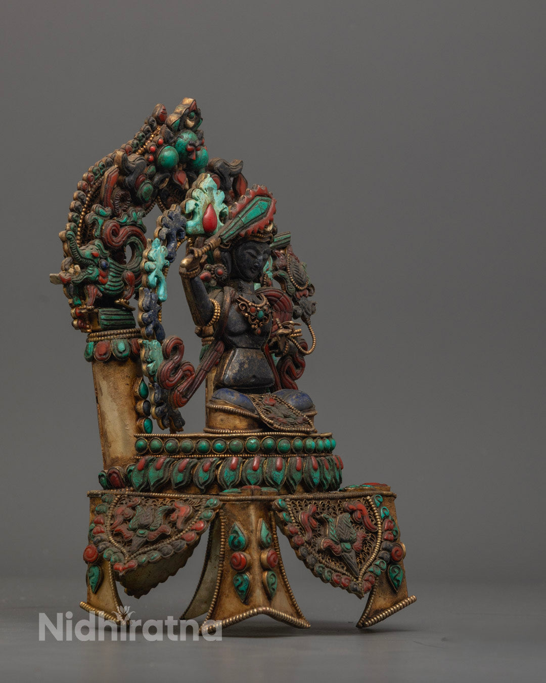 Colorfully Painted Manjushri Sculpture Showcasing Detailed Robes and Ornaments