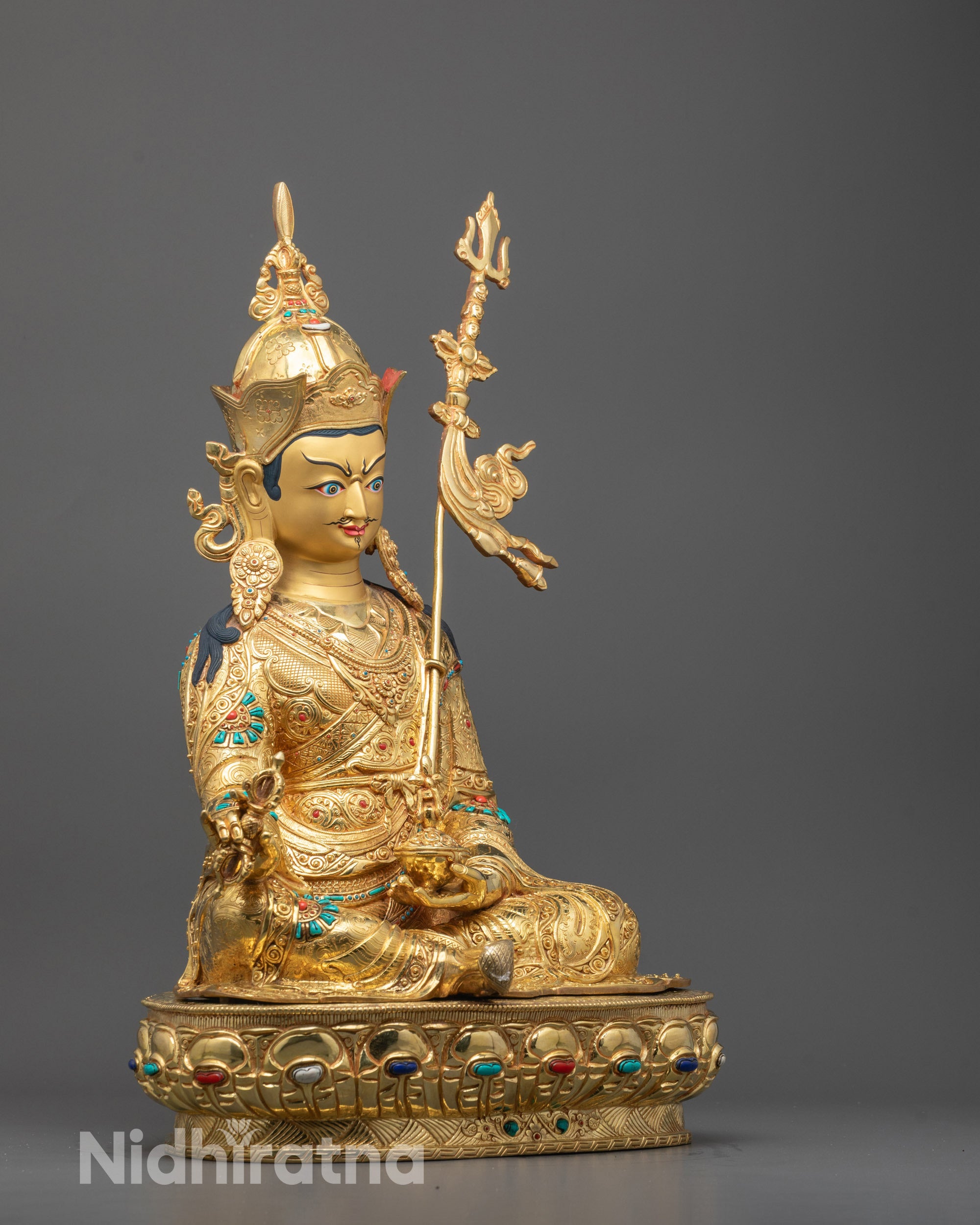 Side Angle of Guru Rinpoche Statue Featuring Fire Gold Detailing and Sacred Robes