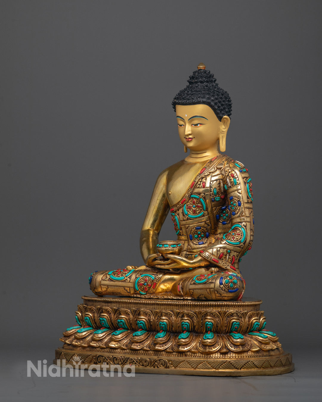 Side angle of Amitabha Tathagata statue showing gold fire-gilded body and detailed robe