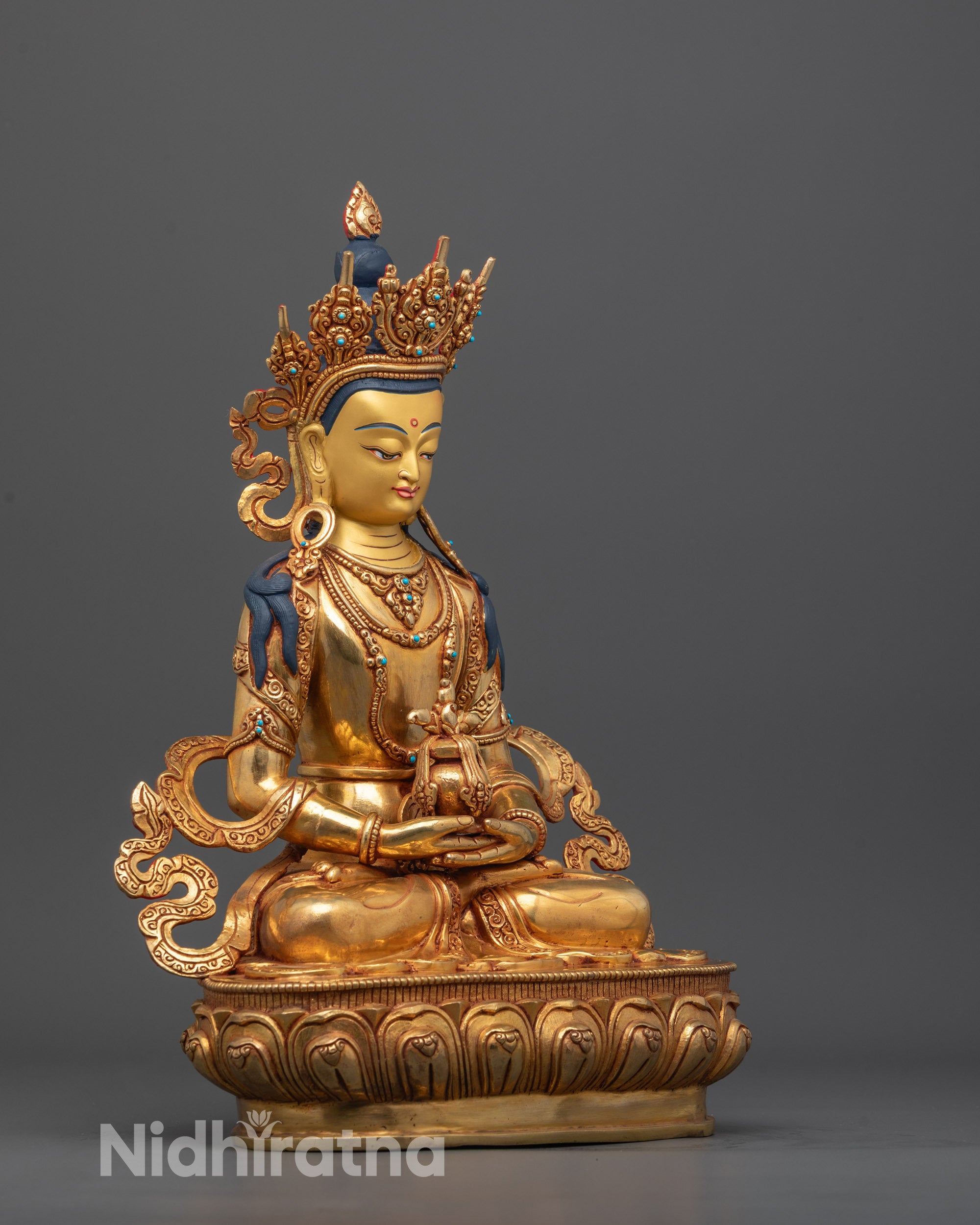 Side angle of Amitayus Statue showing gold fire-gilded body and flowing carved robe details