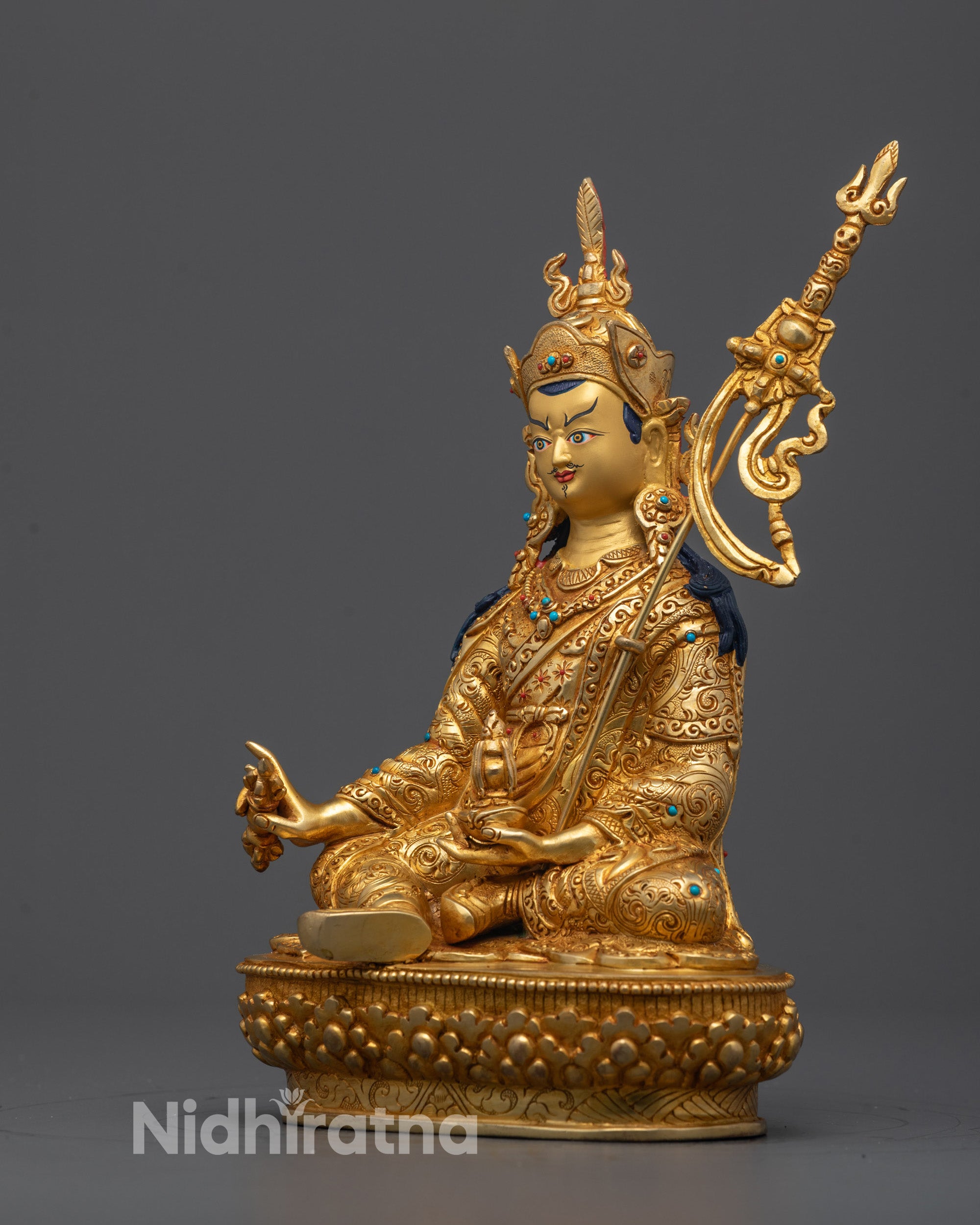Side angle of Guru Rinpoche Statue showing detailed robe carvings
