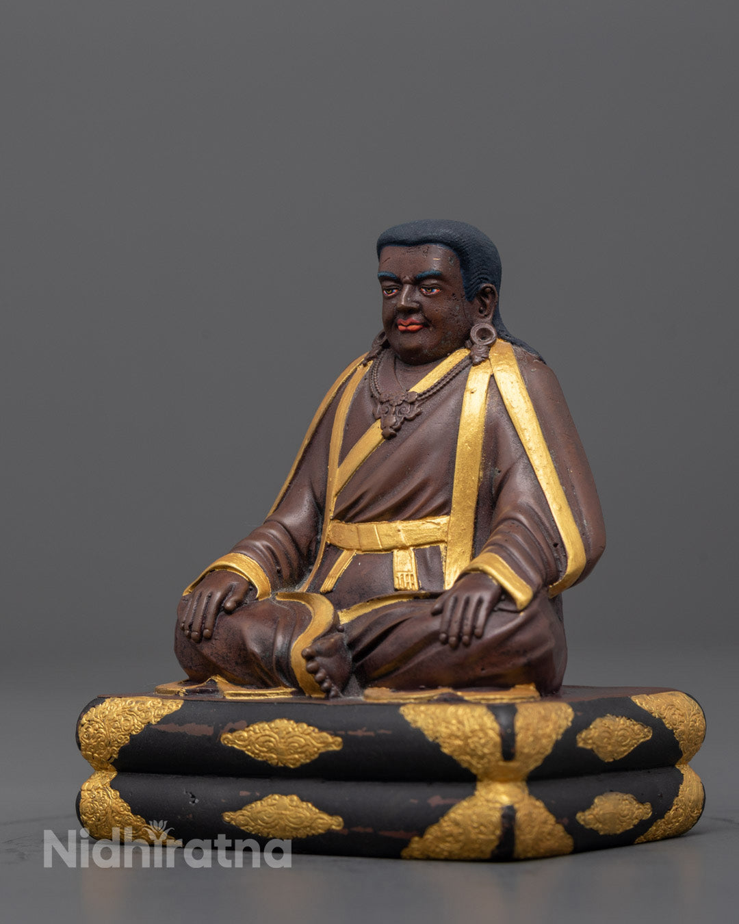 Side angle of Marpha Statue showing detailed robe, jewelry, and oxidized copper finish
