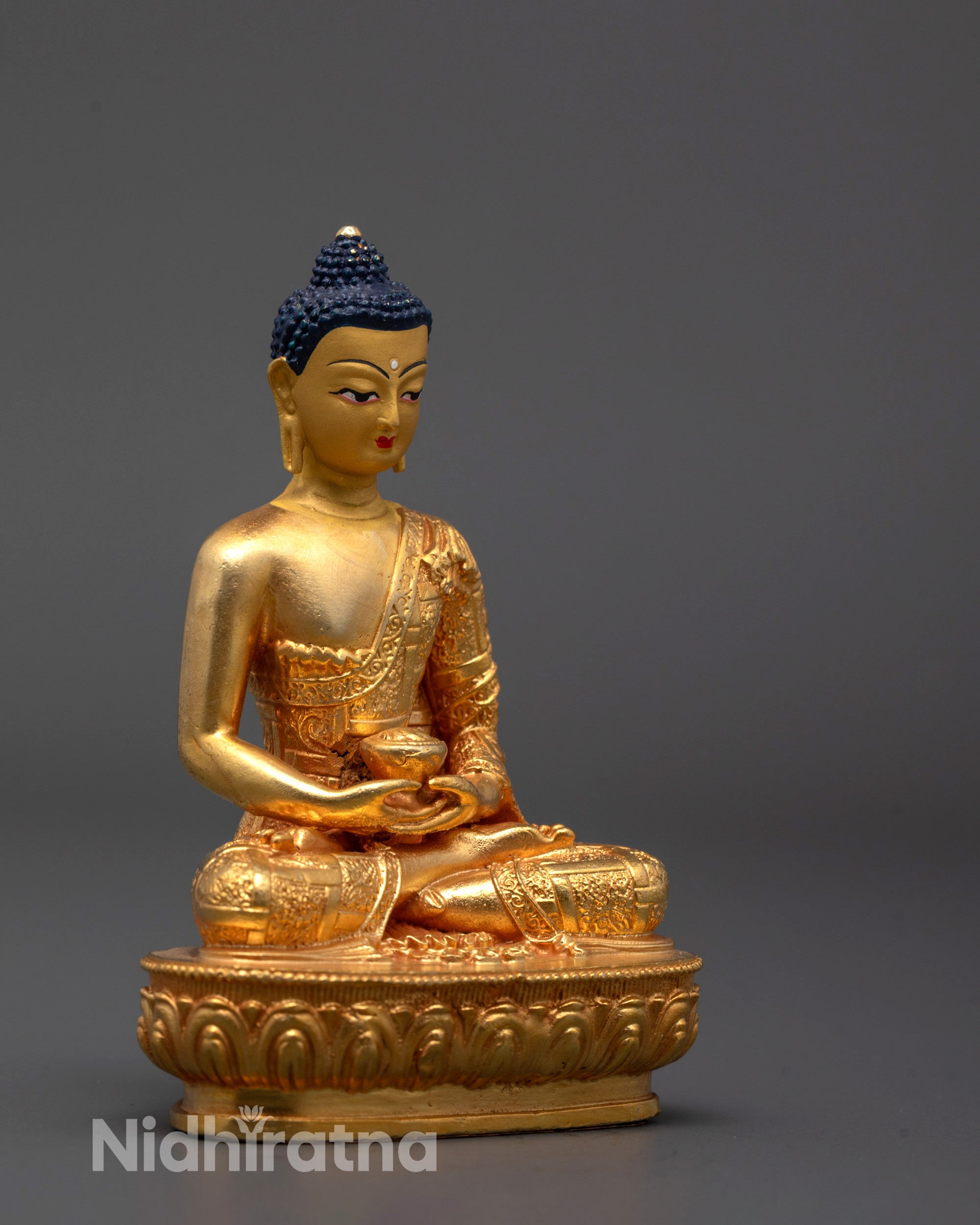 Side angle of Nepal-made Amitabha Buddha sculpture showing detailed robe patterns