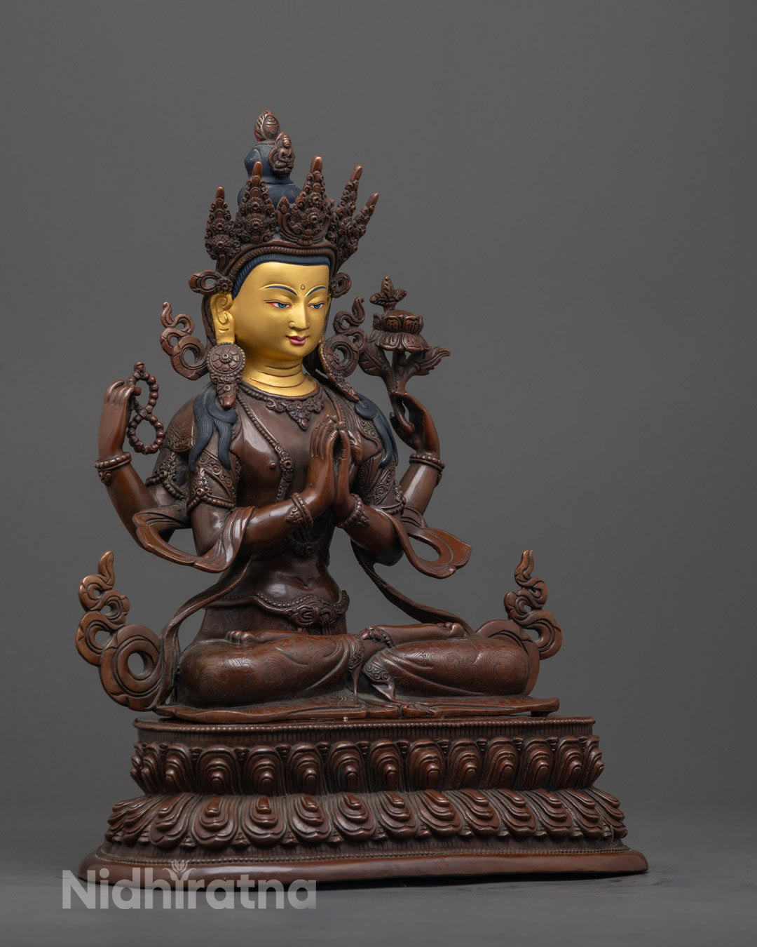 Side angle of Tibetan Chenrezig Bodhisattva statue showing four symbolic arms