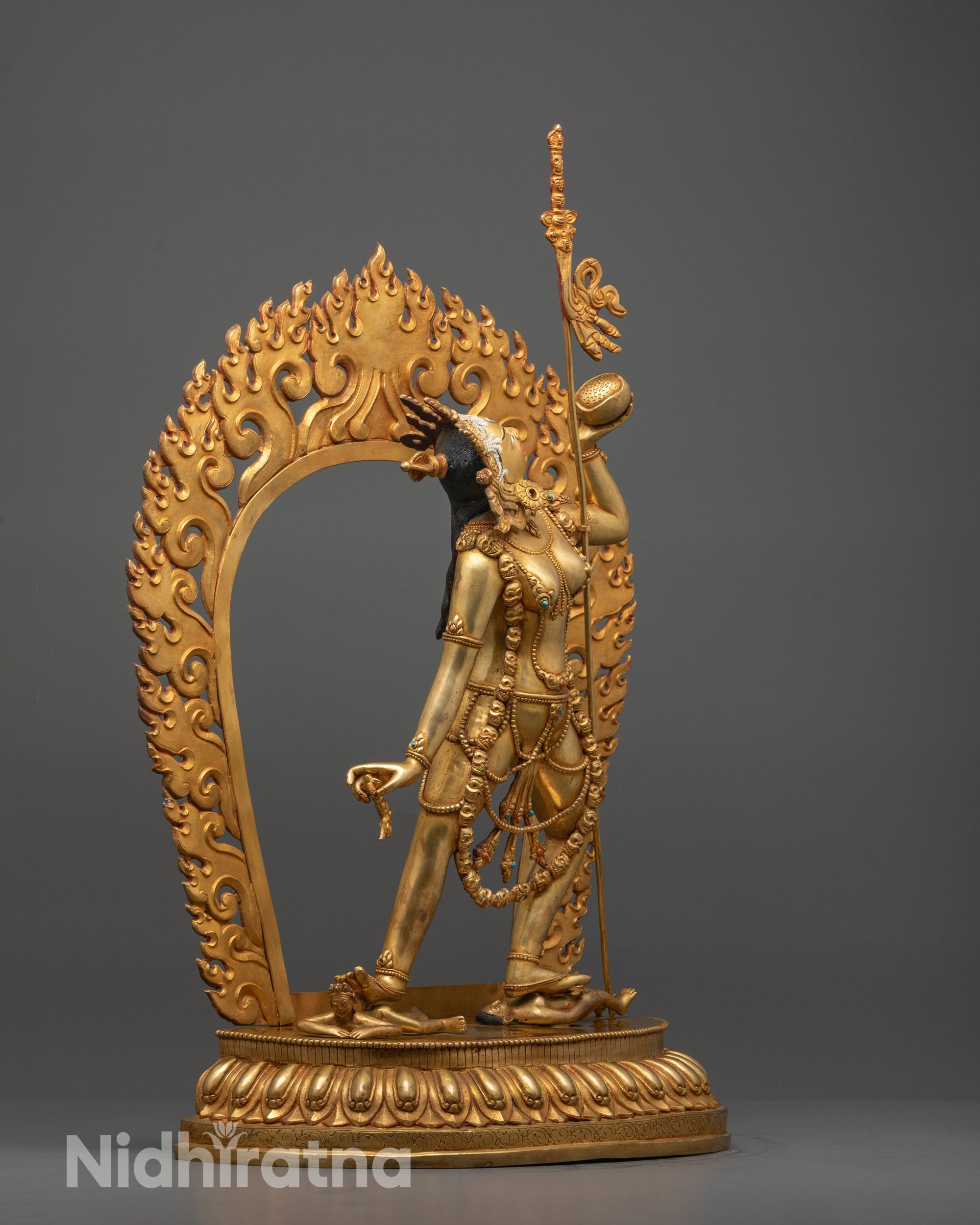 Side angle of Vajrayogini Statue showing intricate flame halo and fine