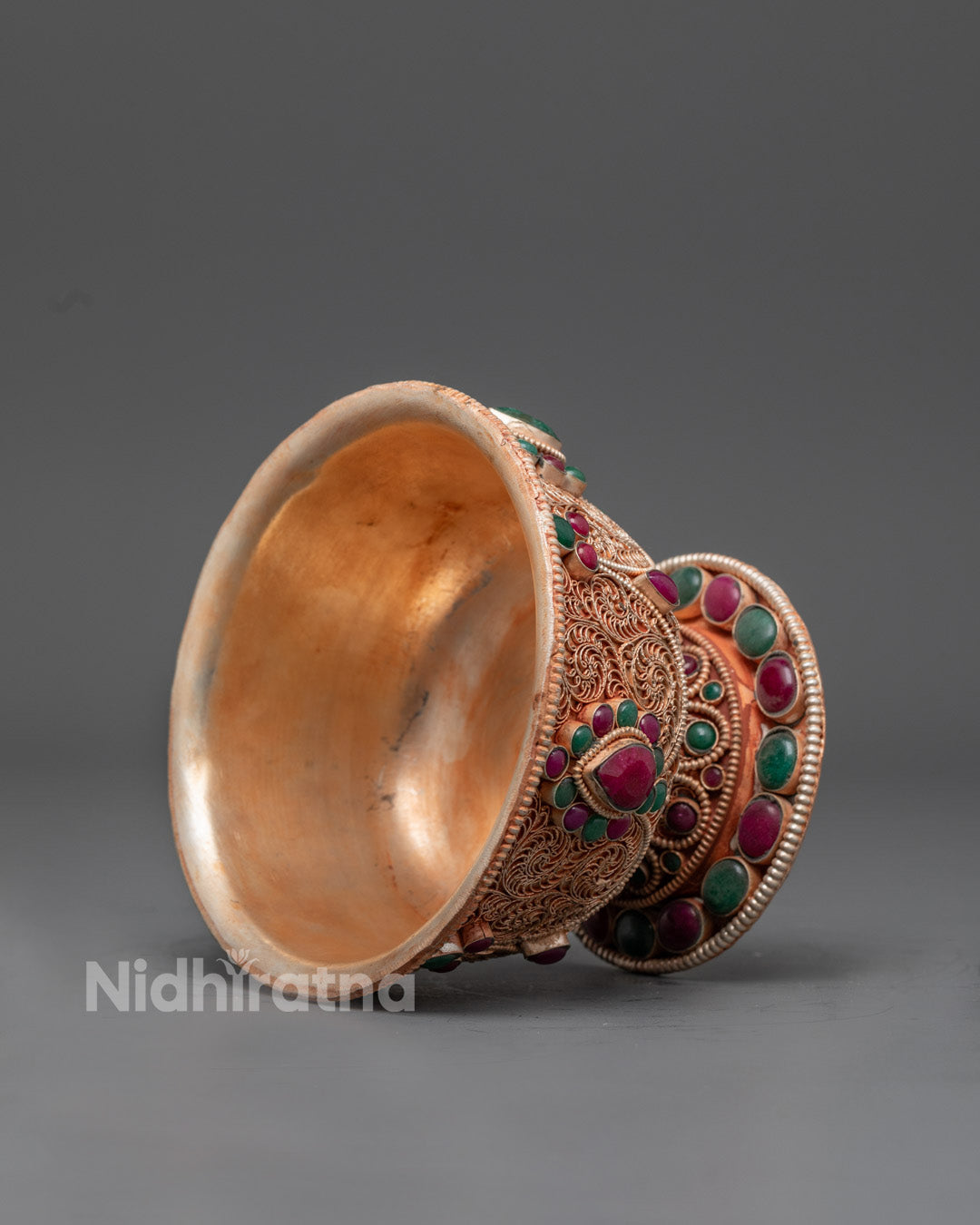Side angle of Watering Offering Bowl featuring lapis lazuli, coral stones, and detailed carvings