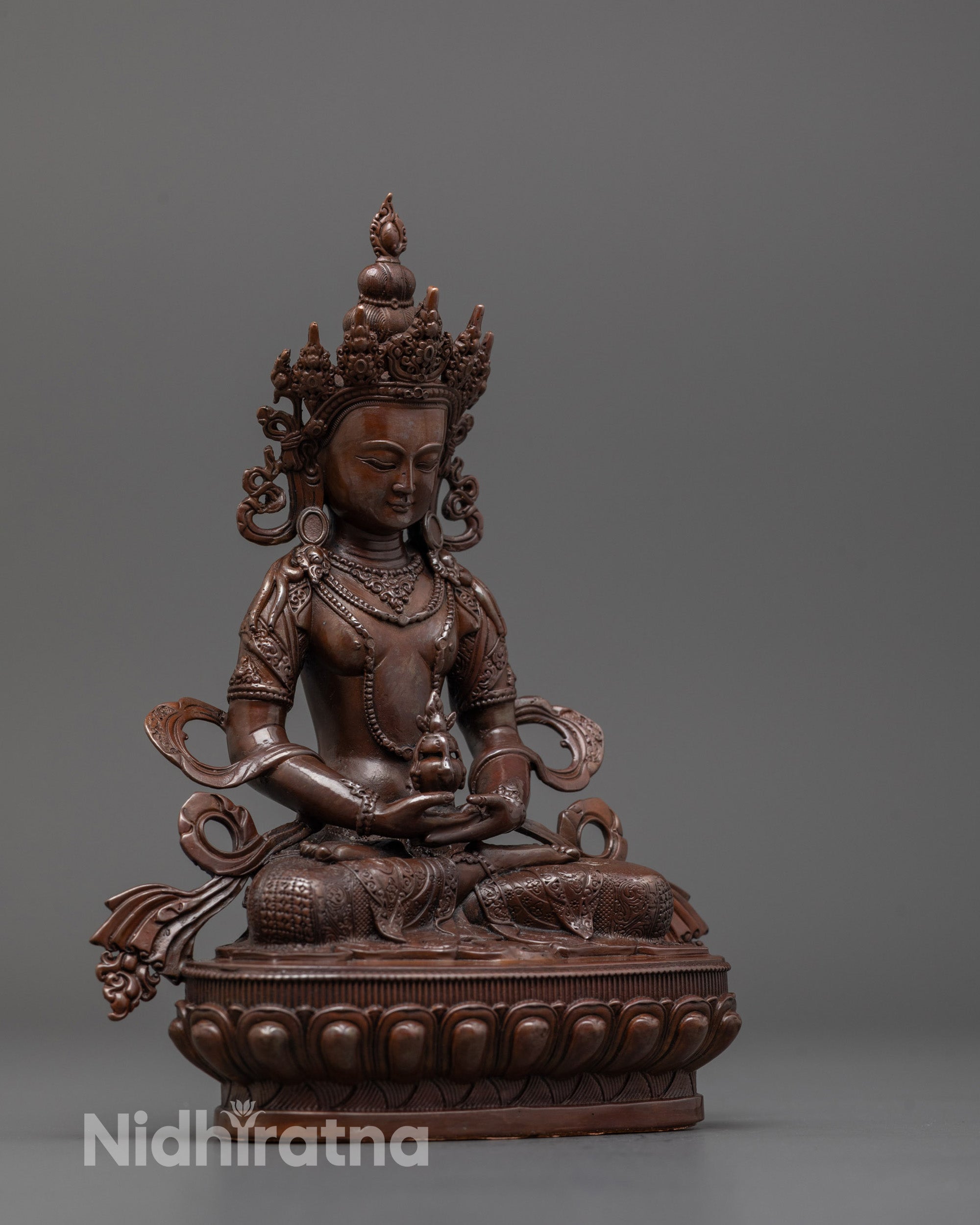 Side angle of electroplated Amitayus statue holding nectar in Dhayana mudra pose