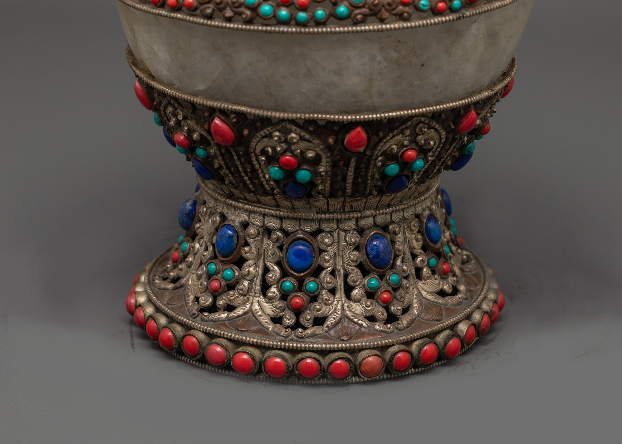 Side angle of handcrafted Dhupur Rice Pot adorned with coral, turquoise, and lapis lazuli