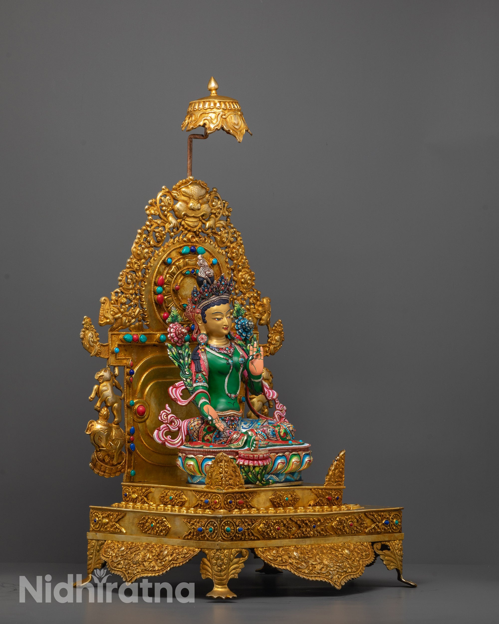 Side angle of handcrafted Green Tara Sculpture showing meditative posture