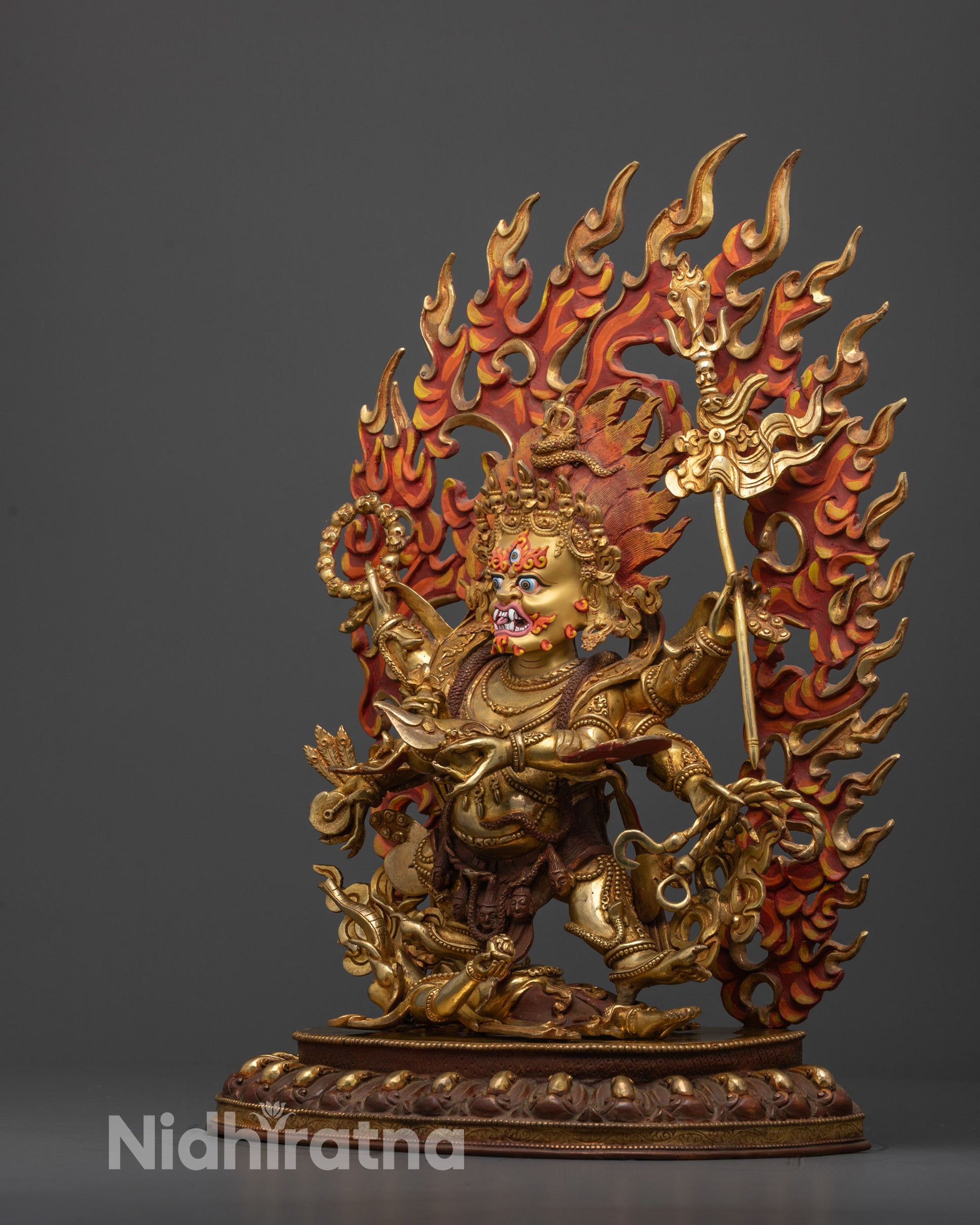 Side angle of handcrafted Mahakala Statue showing Phurba, lasso, and detailed robe