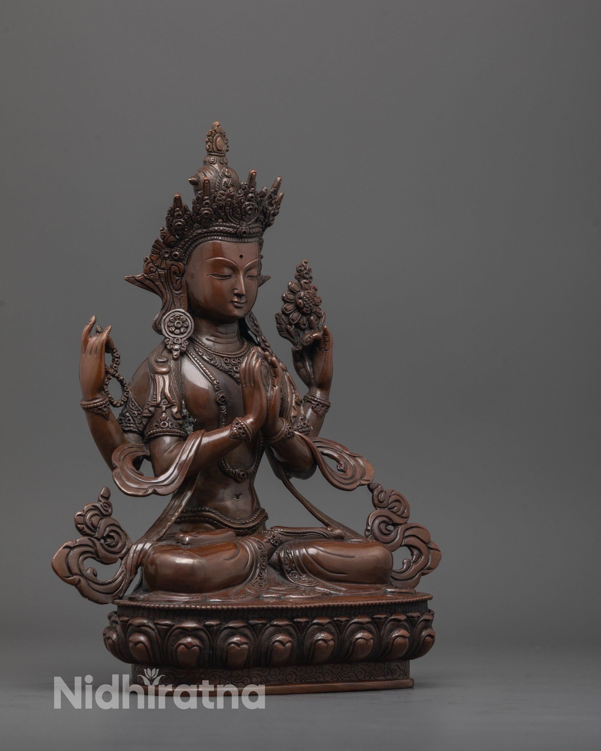 Side angle of oxidized Chenrezig statue showing detailed robes and five-jeweled crown