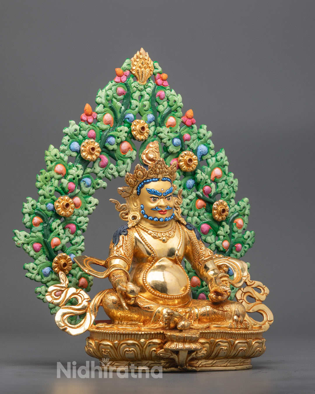 Side angle showing Dzambhala's fire-gilded body and detailed flowing robes