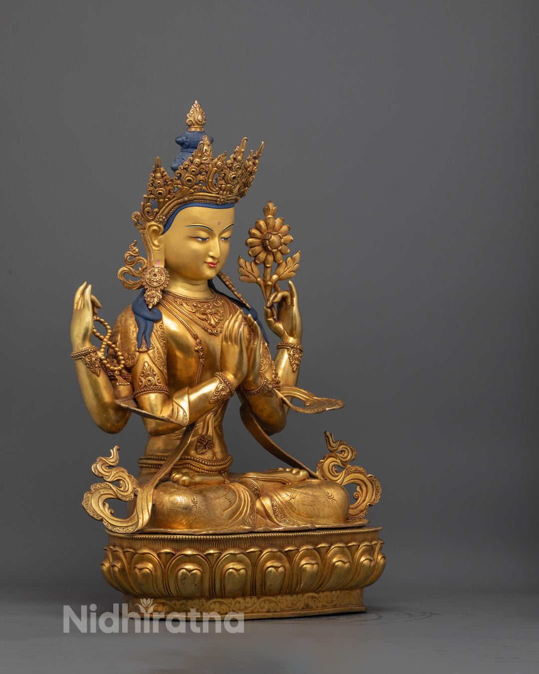 Side angle showing detailed craftsmanship and traditional gilding on Chenrezig