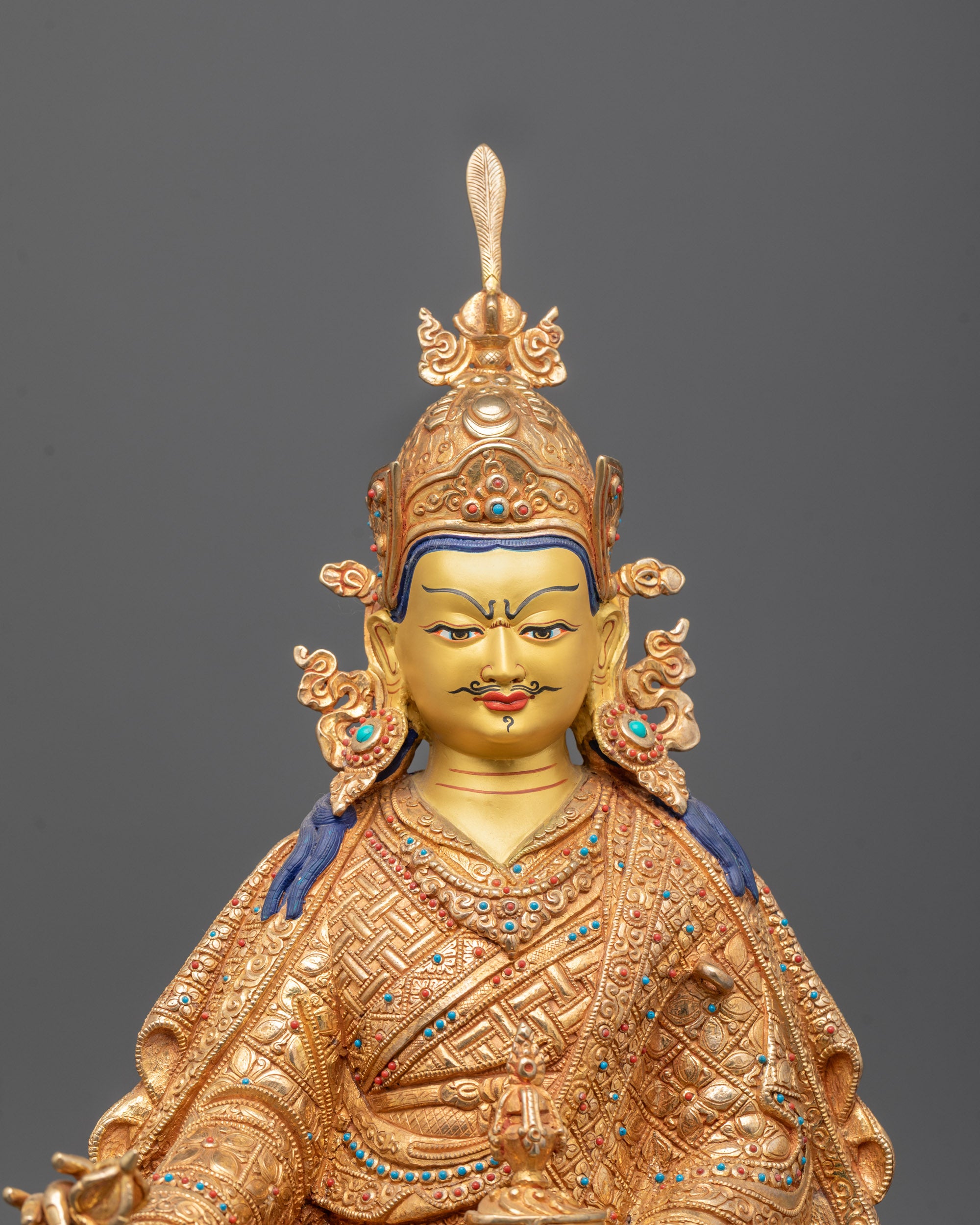 Side angle showing detailed craftsmanship of Guru Rinpoche’s robes and serene facial features