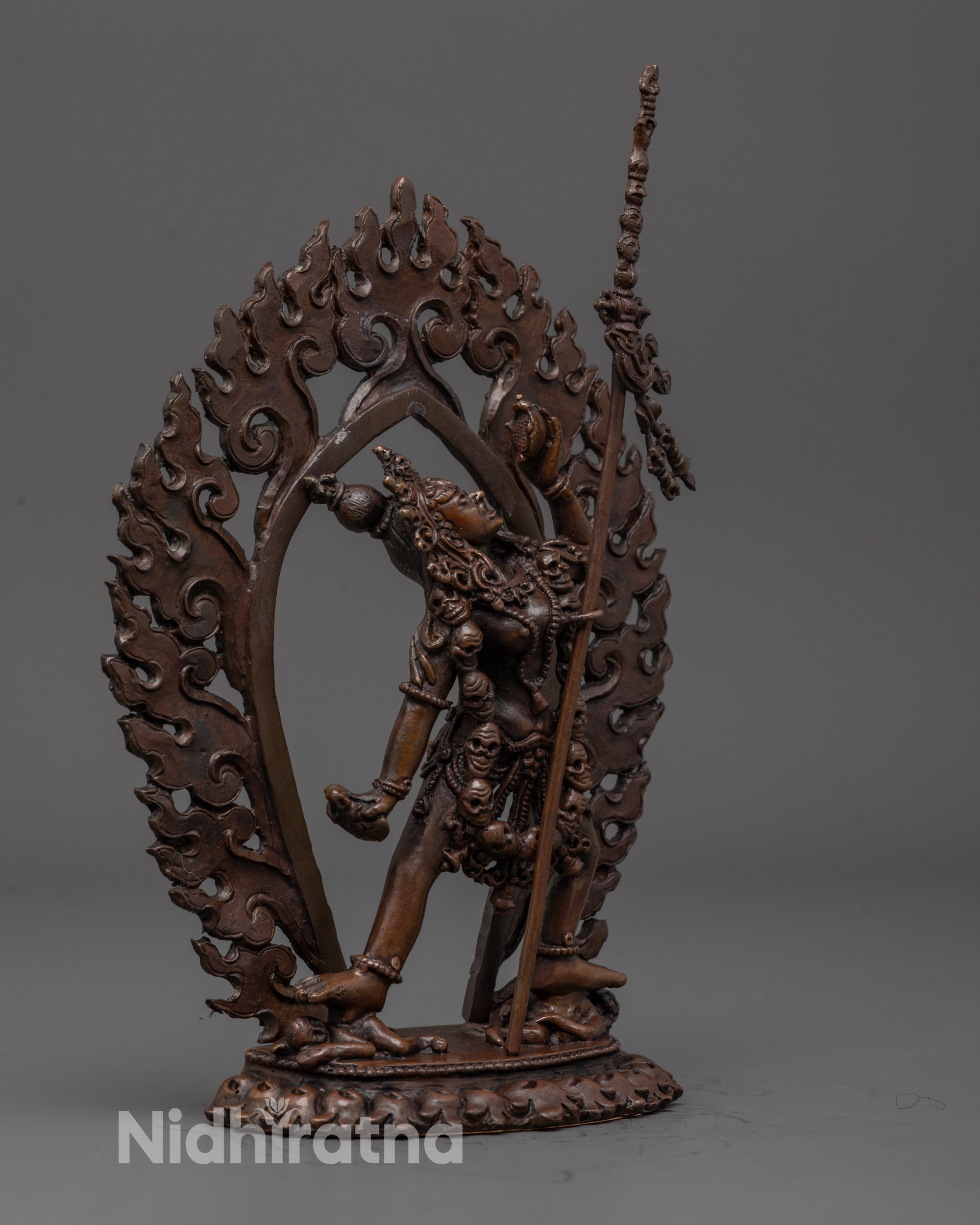 Side angle showing dynamic stance and intricate detailing of Vajrayogini protector statue