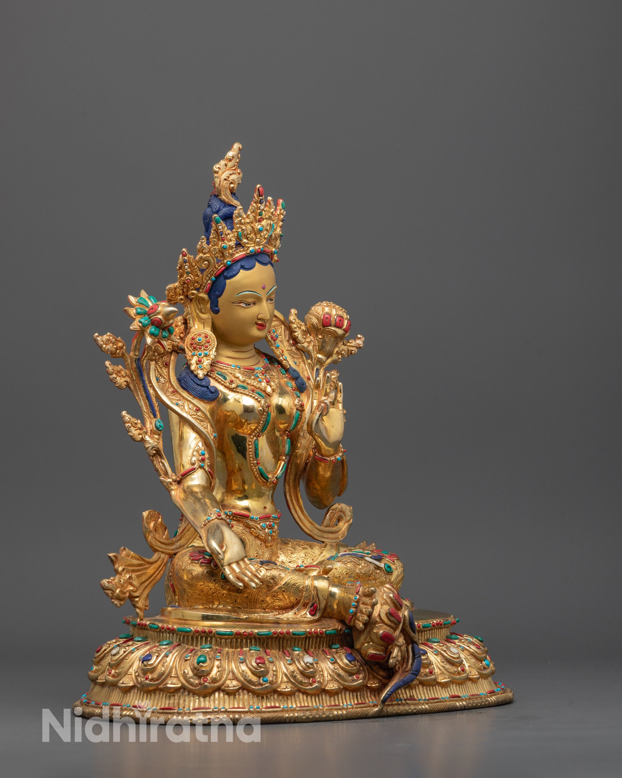 Side angle showing intricate details and traditional craftsmanship of the Green Tara Statue