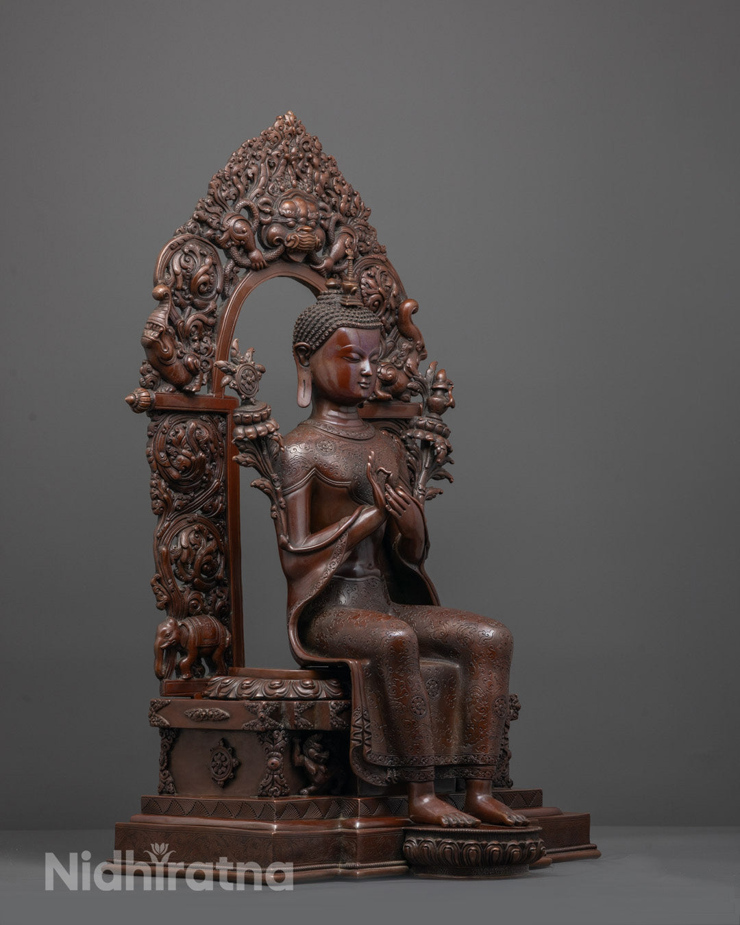 Side angle showing utpala flower and detailed carvings on Maitreya Buddha statue