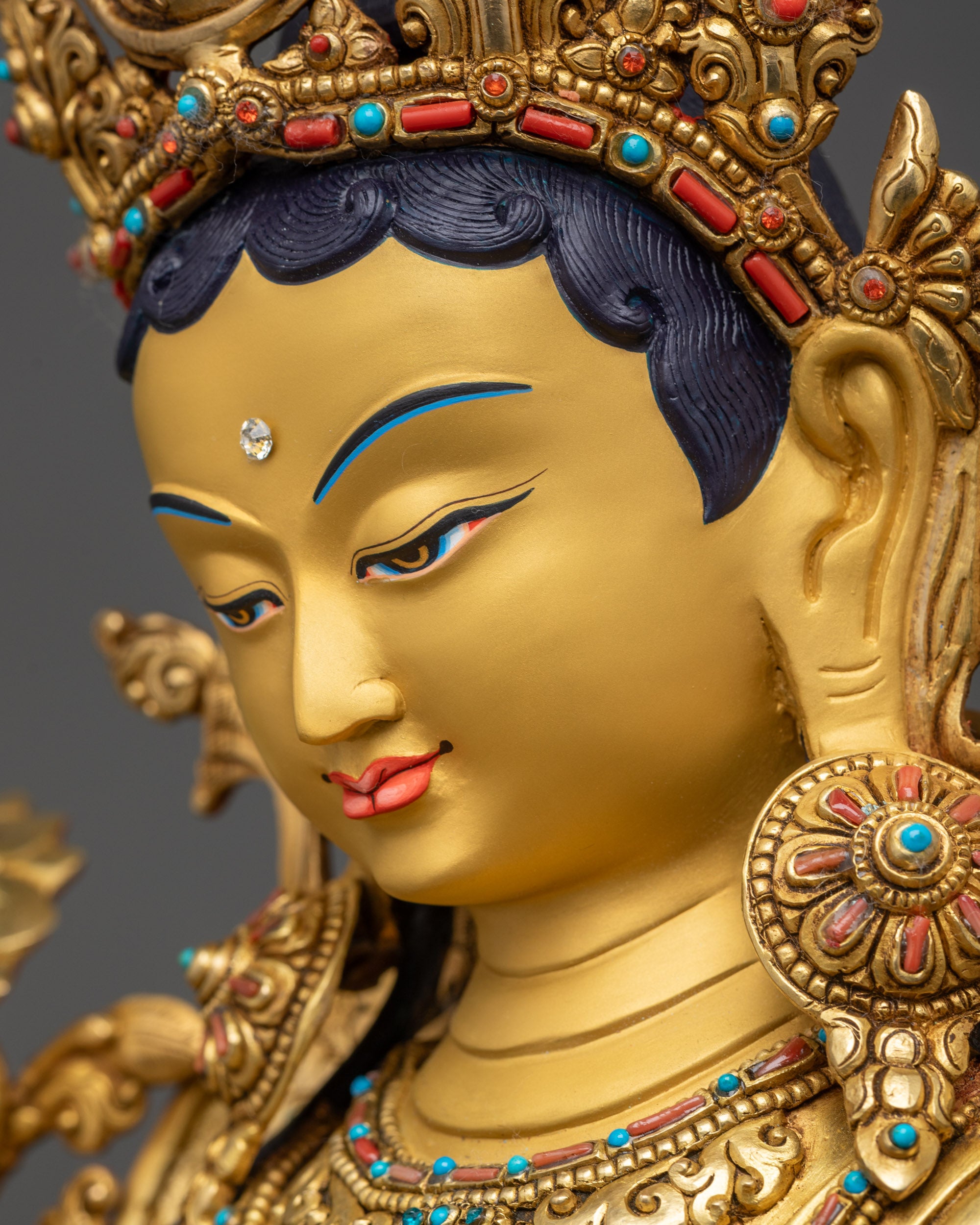 Side close up face of Premium Green Tara with intricate earrings and necklace details