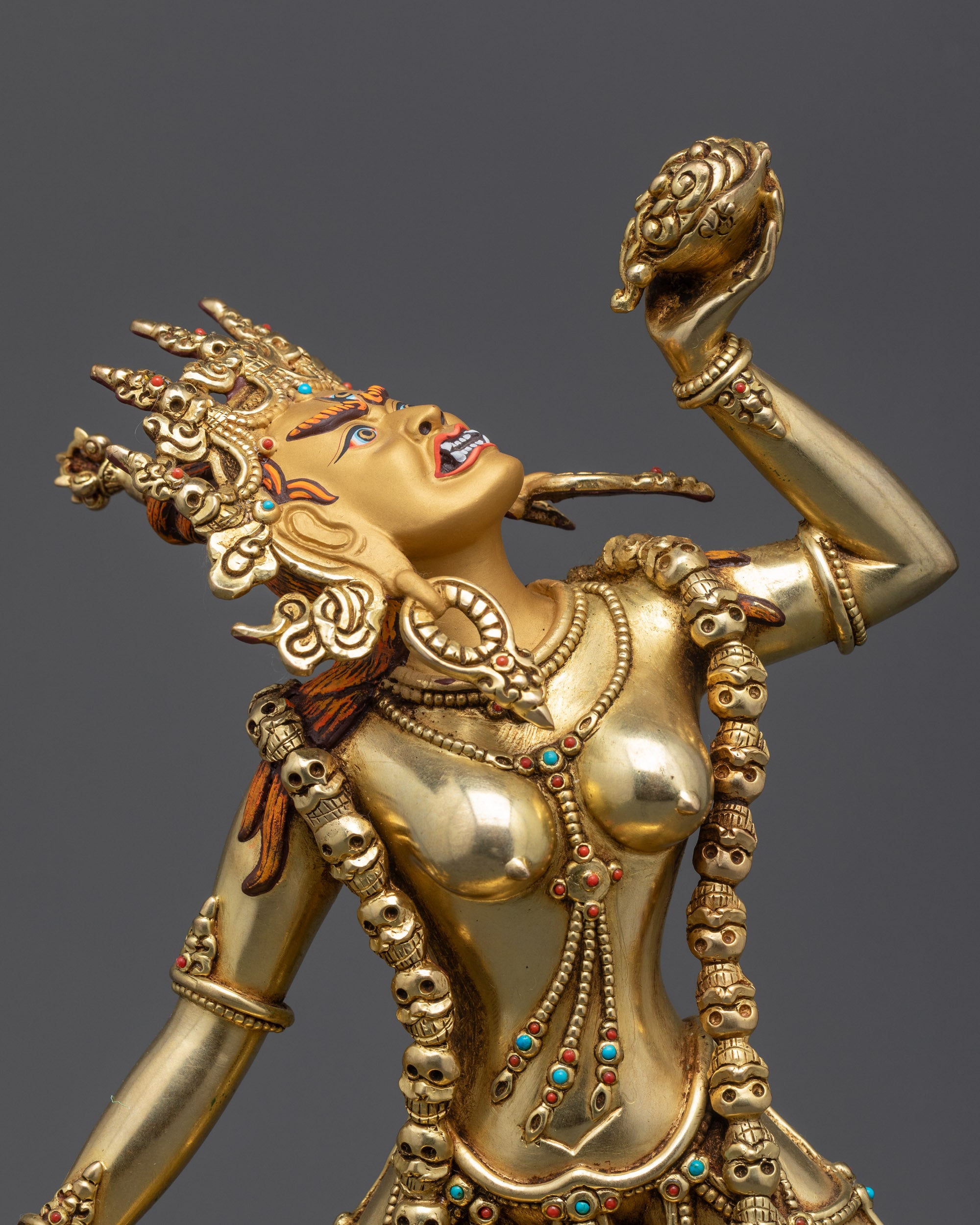 Side close up face of Vajrayogini showing flaying knife and kapala cup