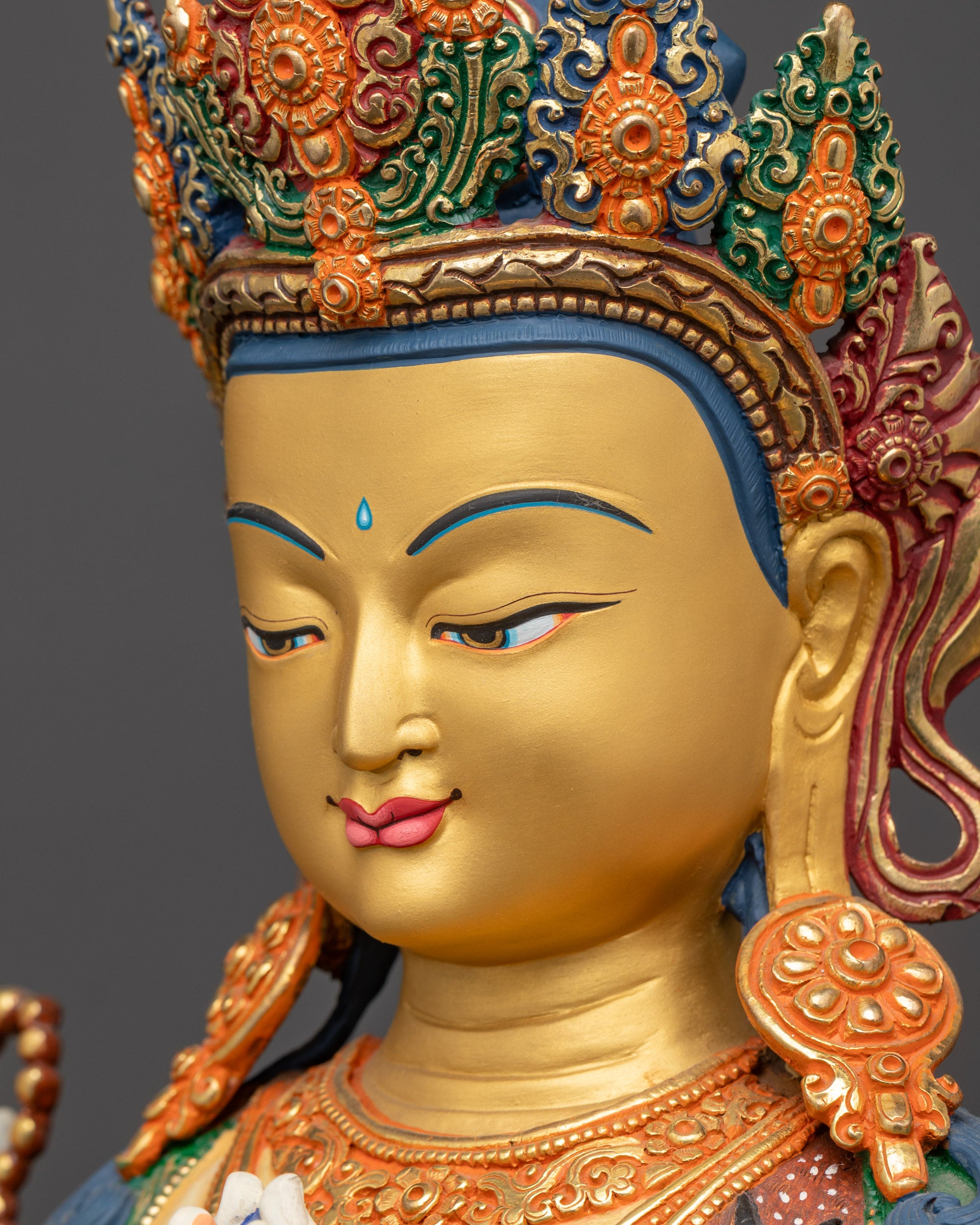 Side close up face of White-Hued Chenrezig Bodhisattva sculpture with serene expression