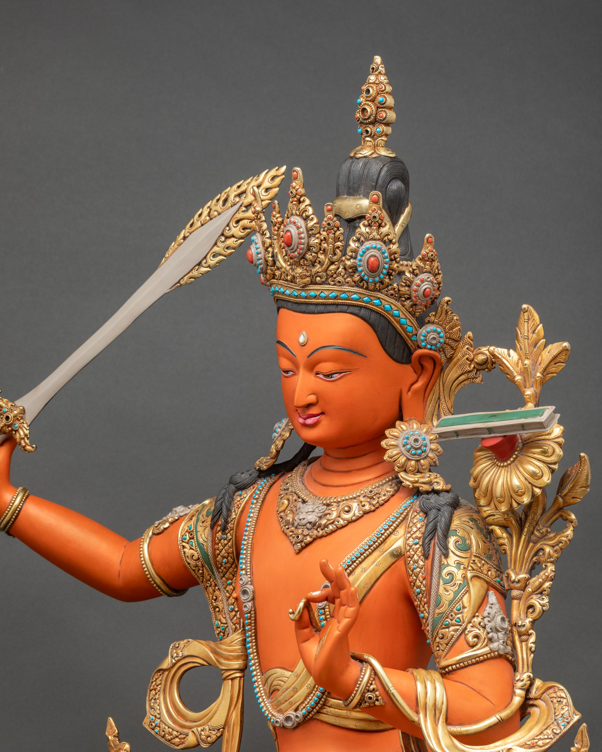 Side close up of handpainted Manjushri Statue β Gold robed Tibetan Buddhist Sculpture detail