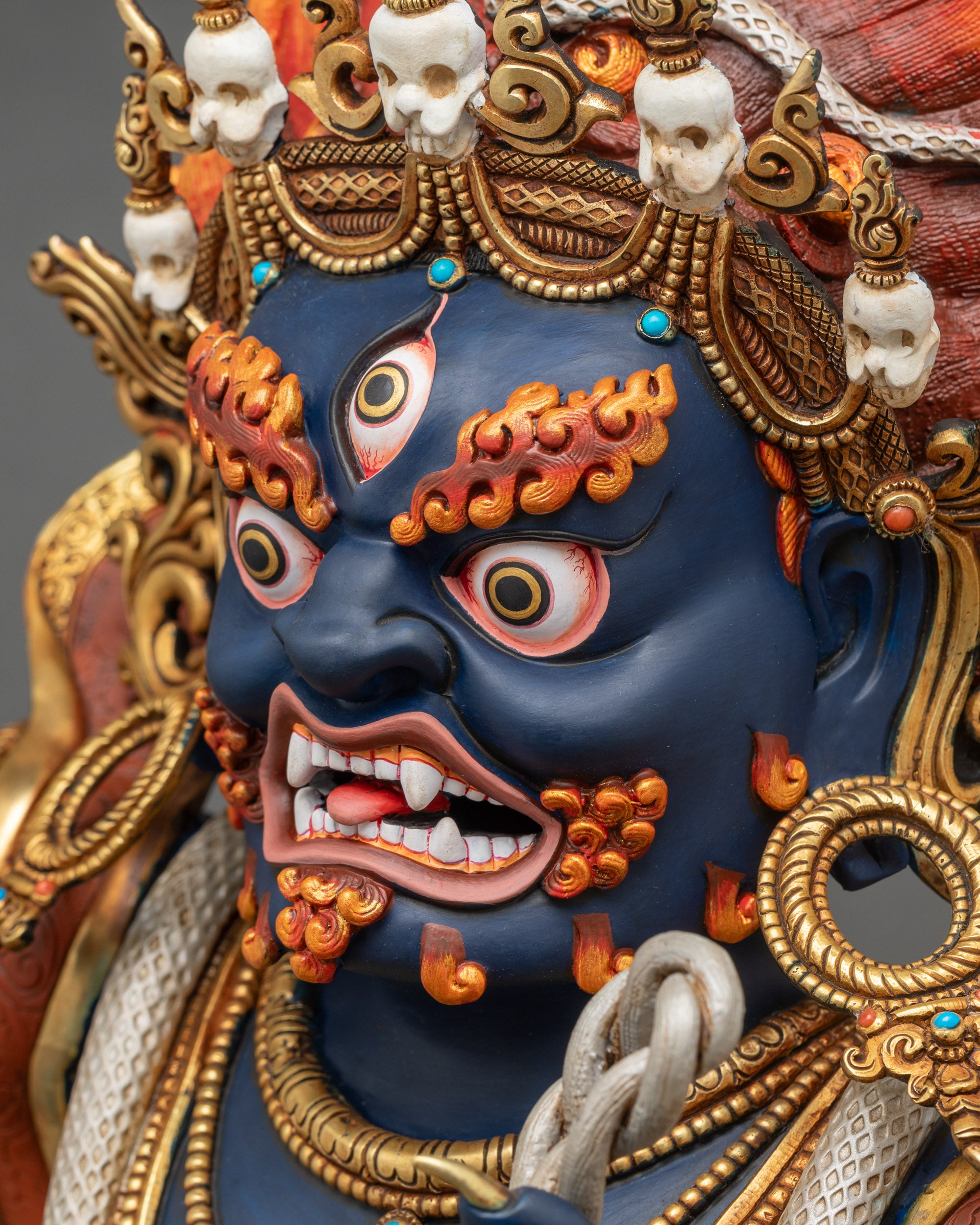 Side face close-up capturing wrathful Vajrapani expression and intricate craftsmanship