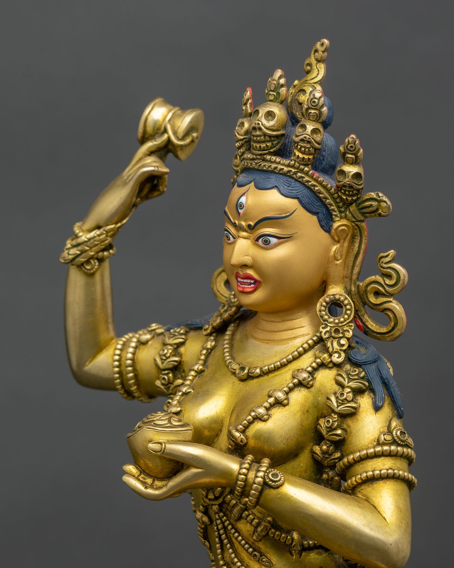 Side-face-close-up-of-Yeshe-Tsogyal-intricate-facial-features-gold-details