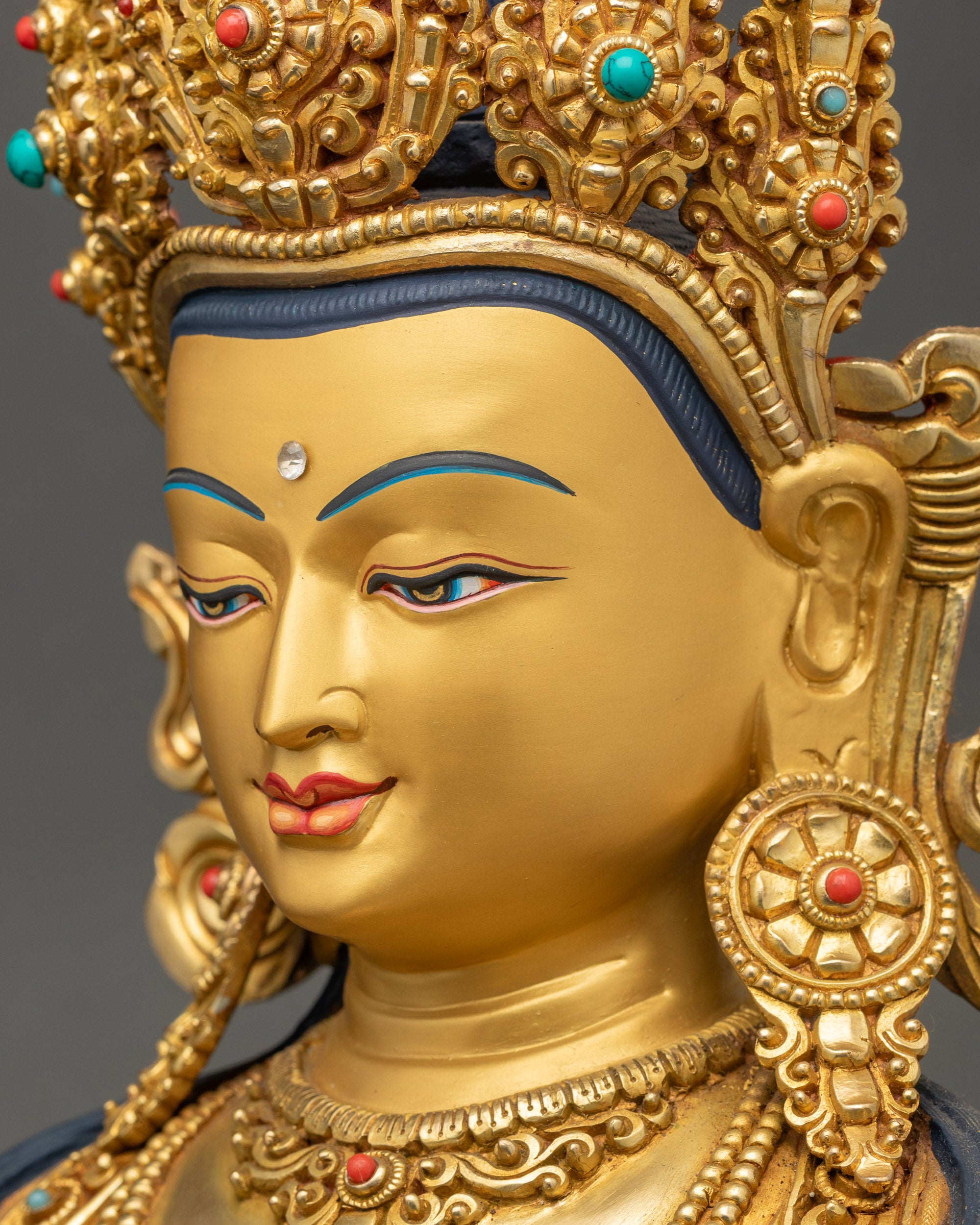 Side face close up of Jizo Kshitigarbha statue showing serene majestic features