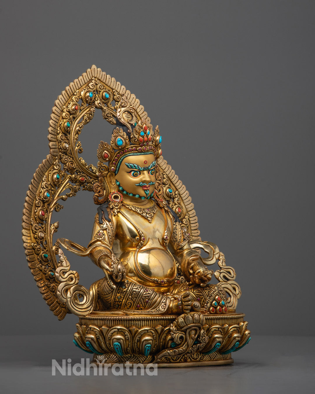 Side profile of Dzambhala Statue highlighting intricate copper craftsmanship