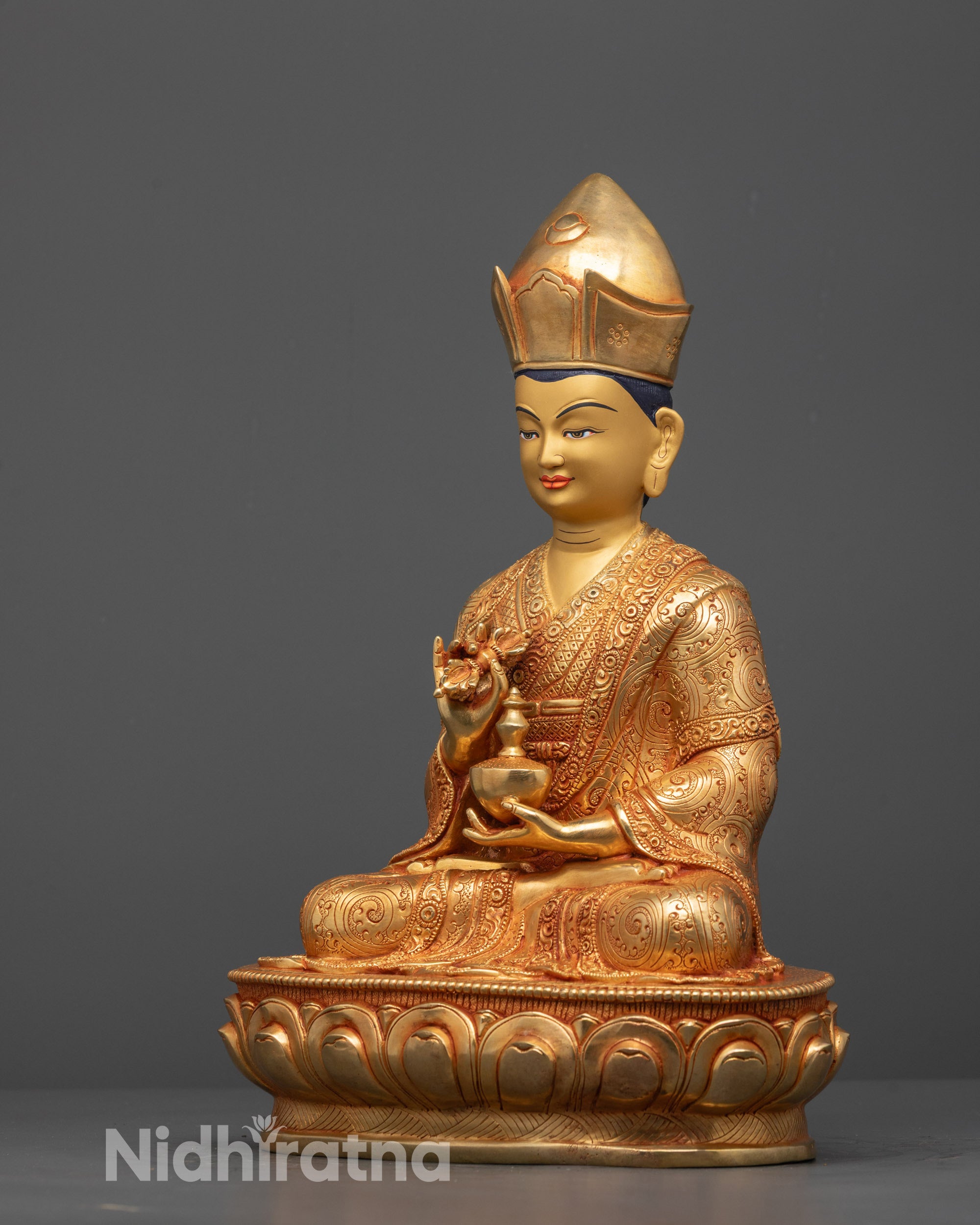 Side profile of Karmapa Statue seated on lotus with hand-carved ornaments