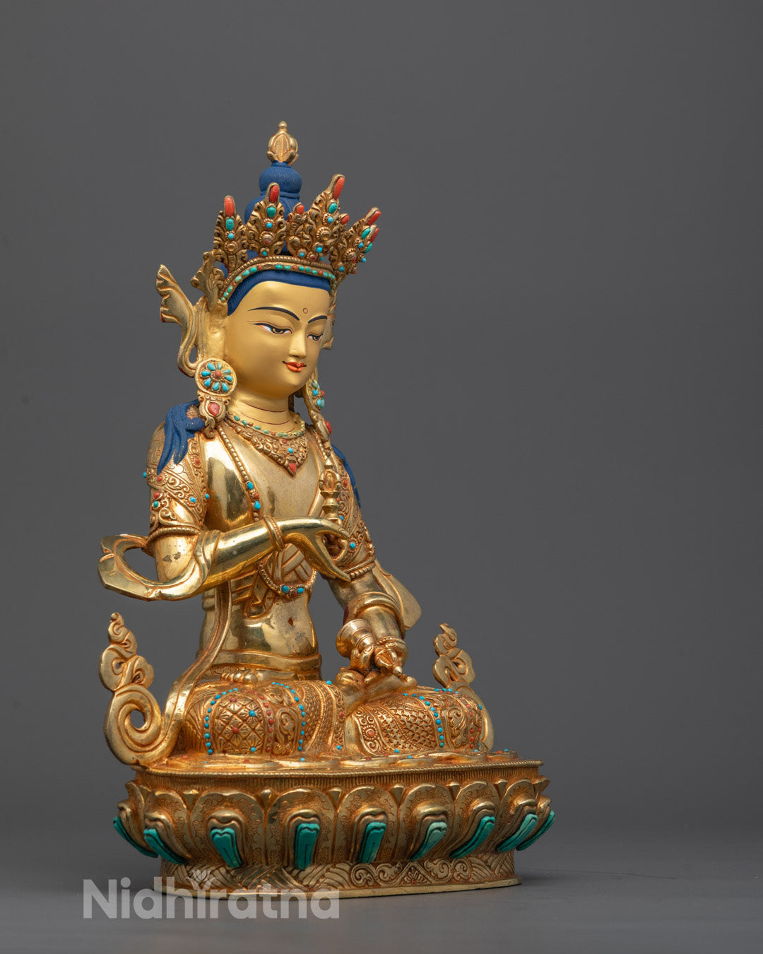 Side profile of Tibetan Vajrasattva Statue showing intricate copper craftsmanship