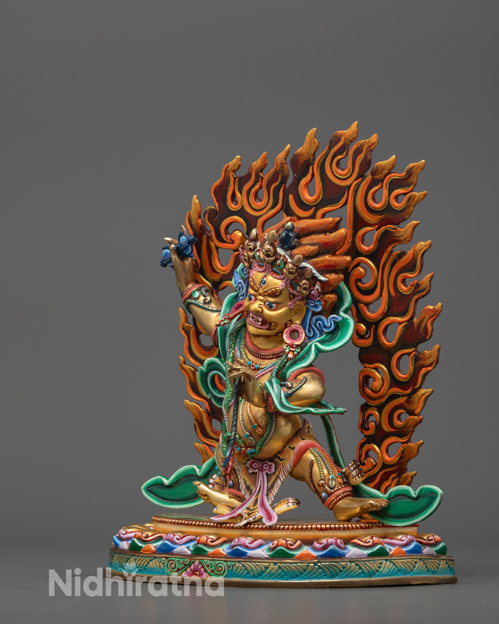 Side profile of a master artisan-crafted Chana Dorje Statue with vibrant gold plating