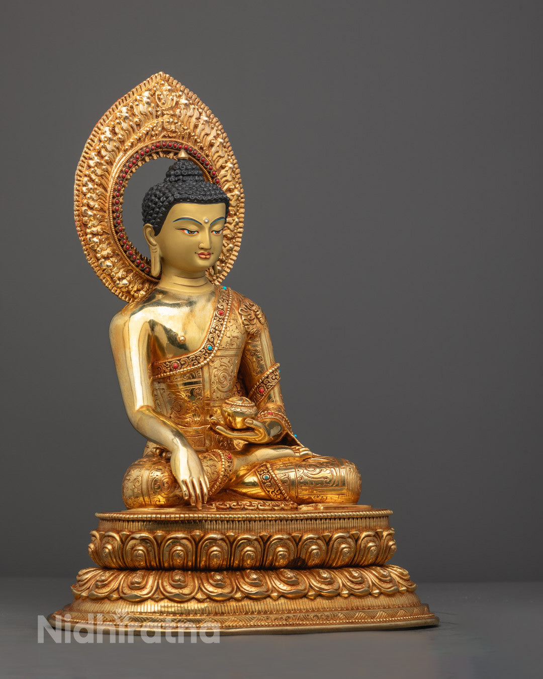 Shakyamuni Buddha statue showing detailed craftsmanship, vibrant acrylic colors, and the serene expression of enlightenment.